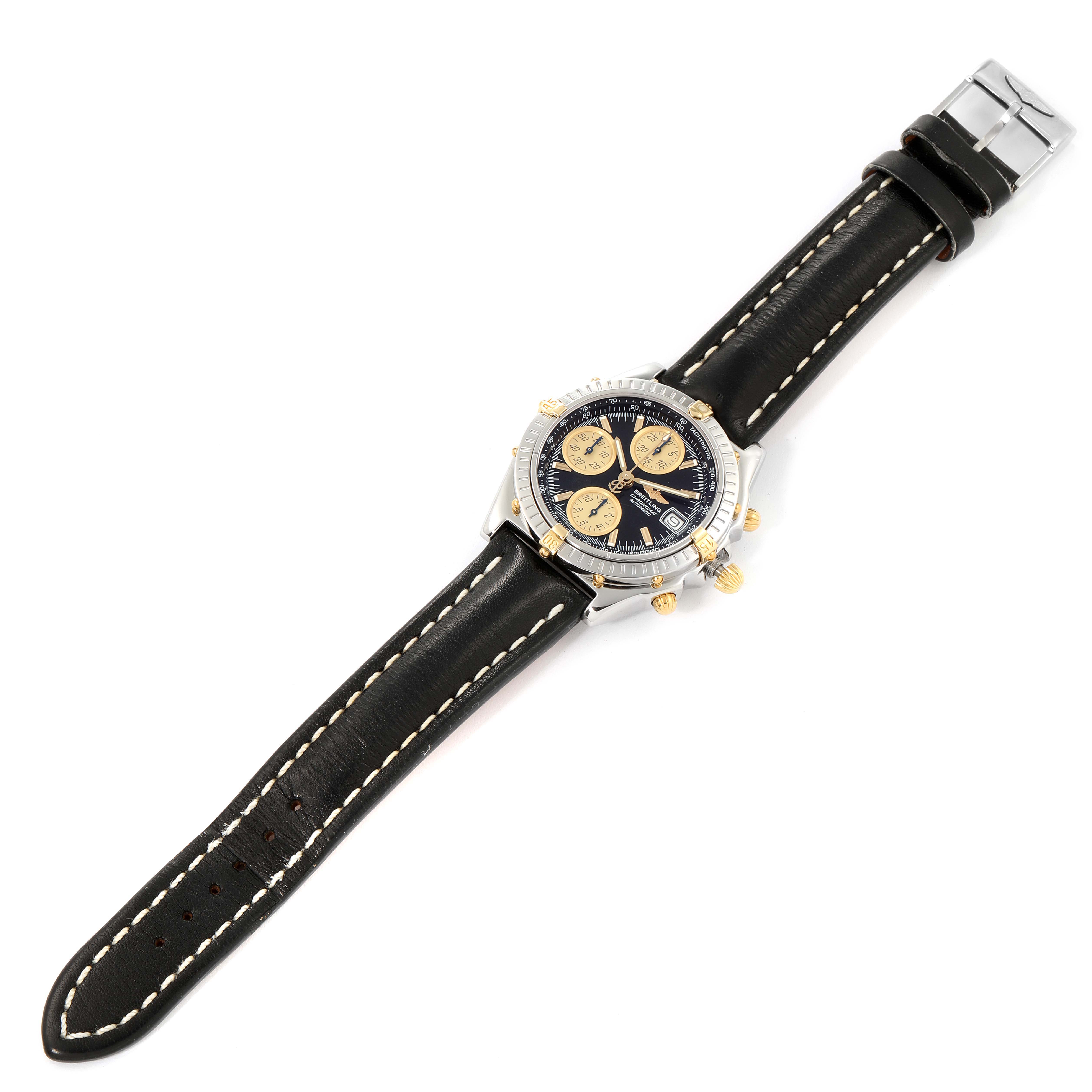 The Breitling Windrider B13350 Men's Steel and Gold (two tone) Black Dial B13350 Men's Steel and Gold (two tone) Black Dial watch is shown from a top-down angle revealing the face, strap, and clasp.