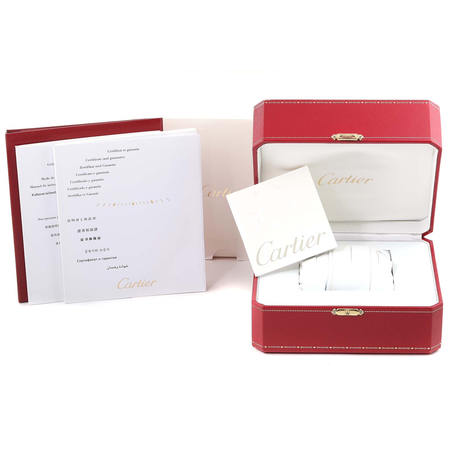 The image shows the packaging and documentation for the Calibre de Cartier watch, including a red Cartier box and instruction booklets.