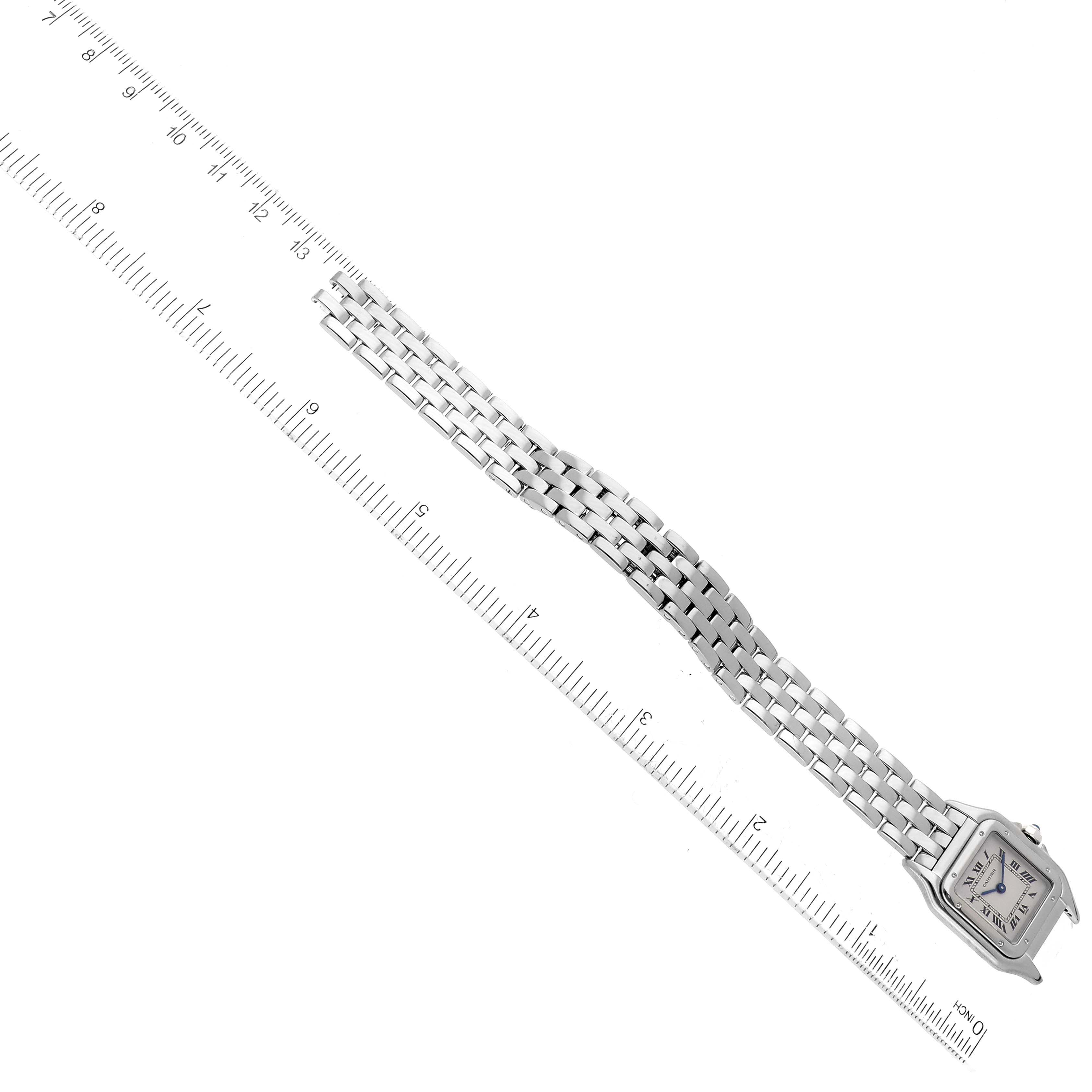 The Cartier Panthere W25016F3 Women
s White Gold Silver Dial W25016F3 Women
s White Gold Silver Dial watch is shown from a top-down angle, including the face, links, and a measurement ruler.