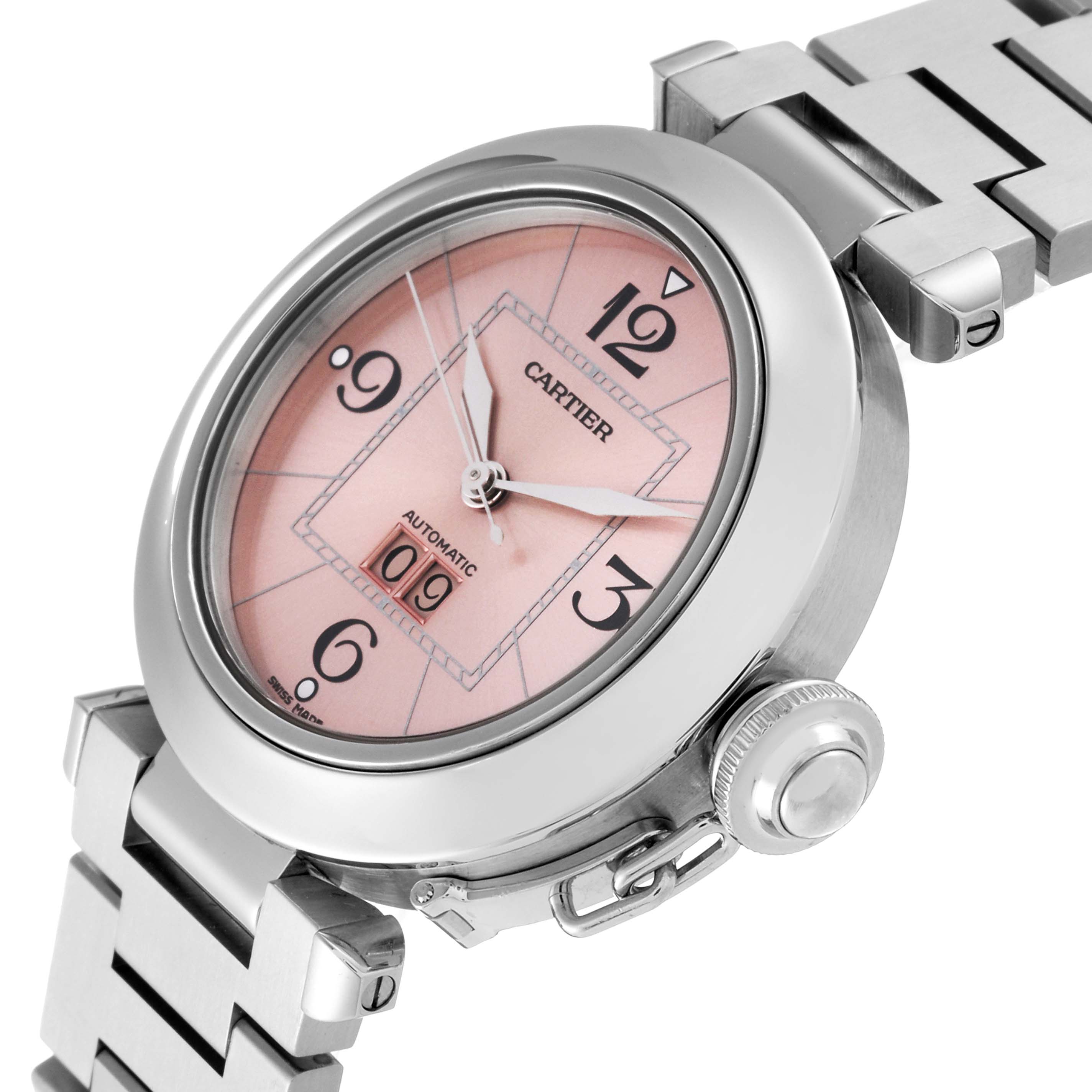 The image shows a Cartier Pasha W31058M7 Women's Stainless Steel Pink Dial W31058M7 Women's Stainless Steel Pink Dial watch at an oblique angle, highlighting its dial, crown, and part of the bracelet.