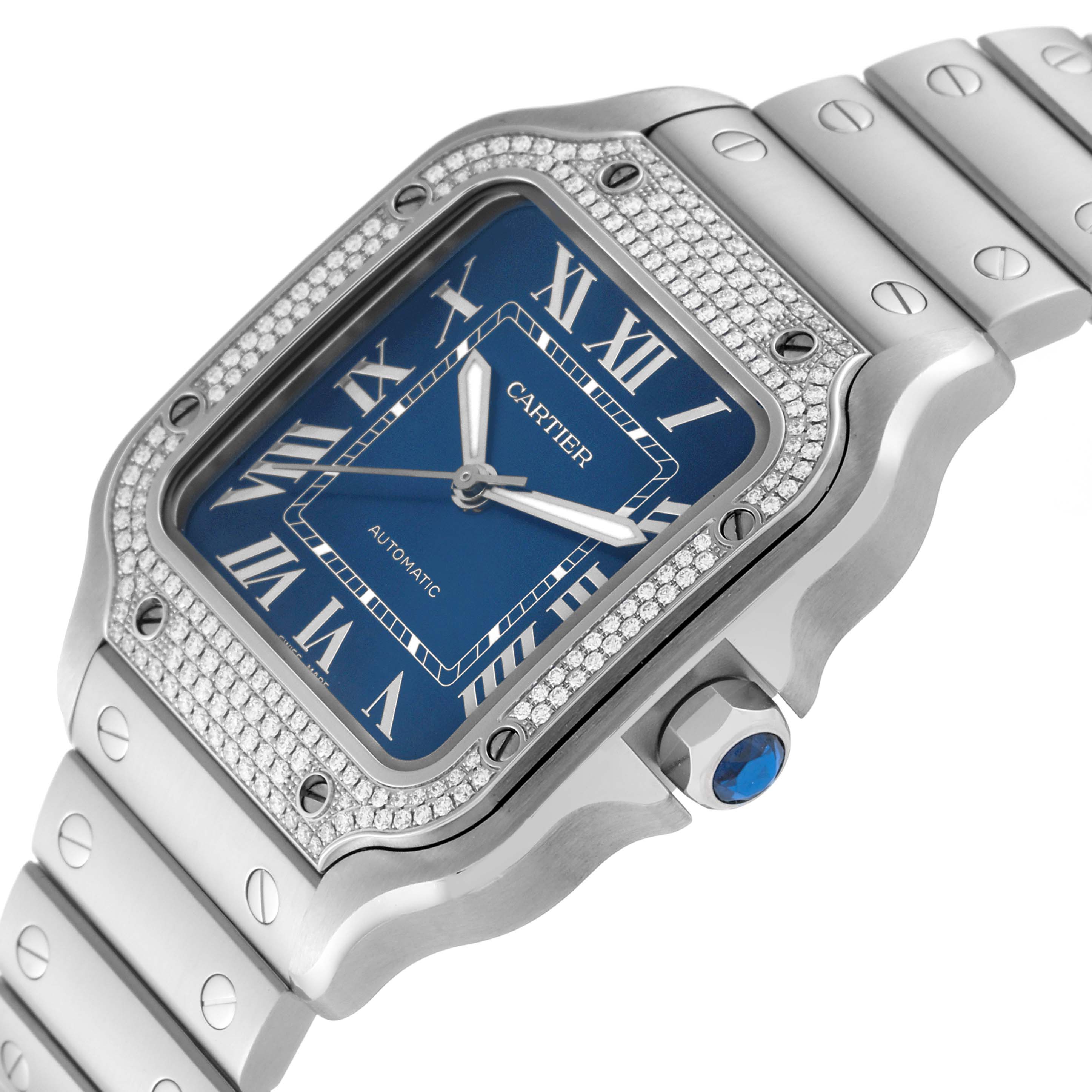 The Cartier Santos W4SA0006 Men's Stainless Steel Blue Dial W4SA0006 Men's Stainless Steel Blue Dial watch is shown at an angle highlighting the bezel, dial, crown, and part of the bracelet.