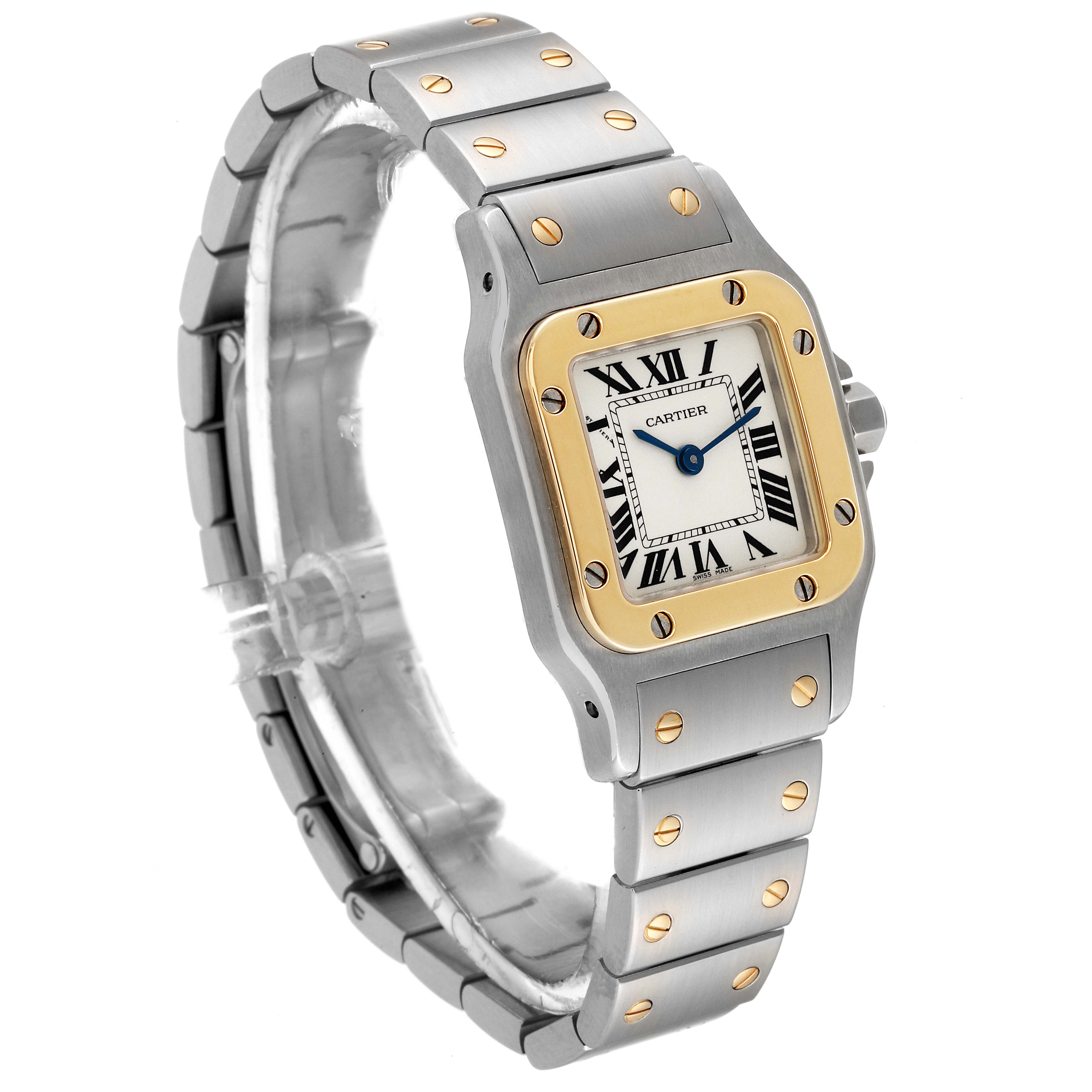 The Cartier Santos W20012C4 Women's Steel and Gold (two tone) Silver Dial W20012C4 Women's Steel and Gold (two tone) Silver Dial watch is shown at a three-quarter angle, highlighting its face, bezel, and bracelet.