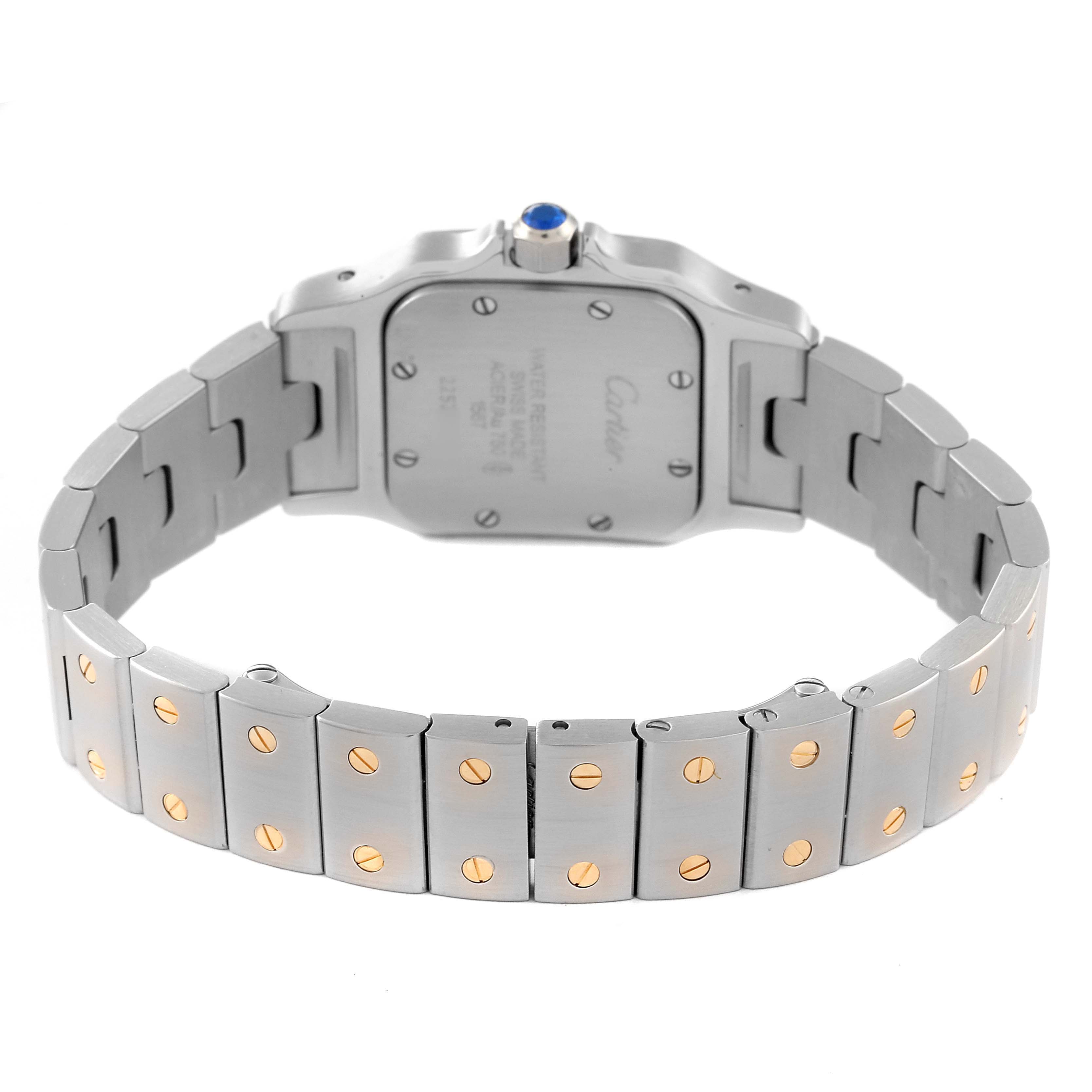 The image shows the rear view of the Santos model watch by Cartier, highlighting the case back and bracelet.