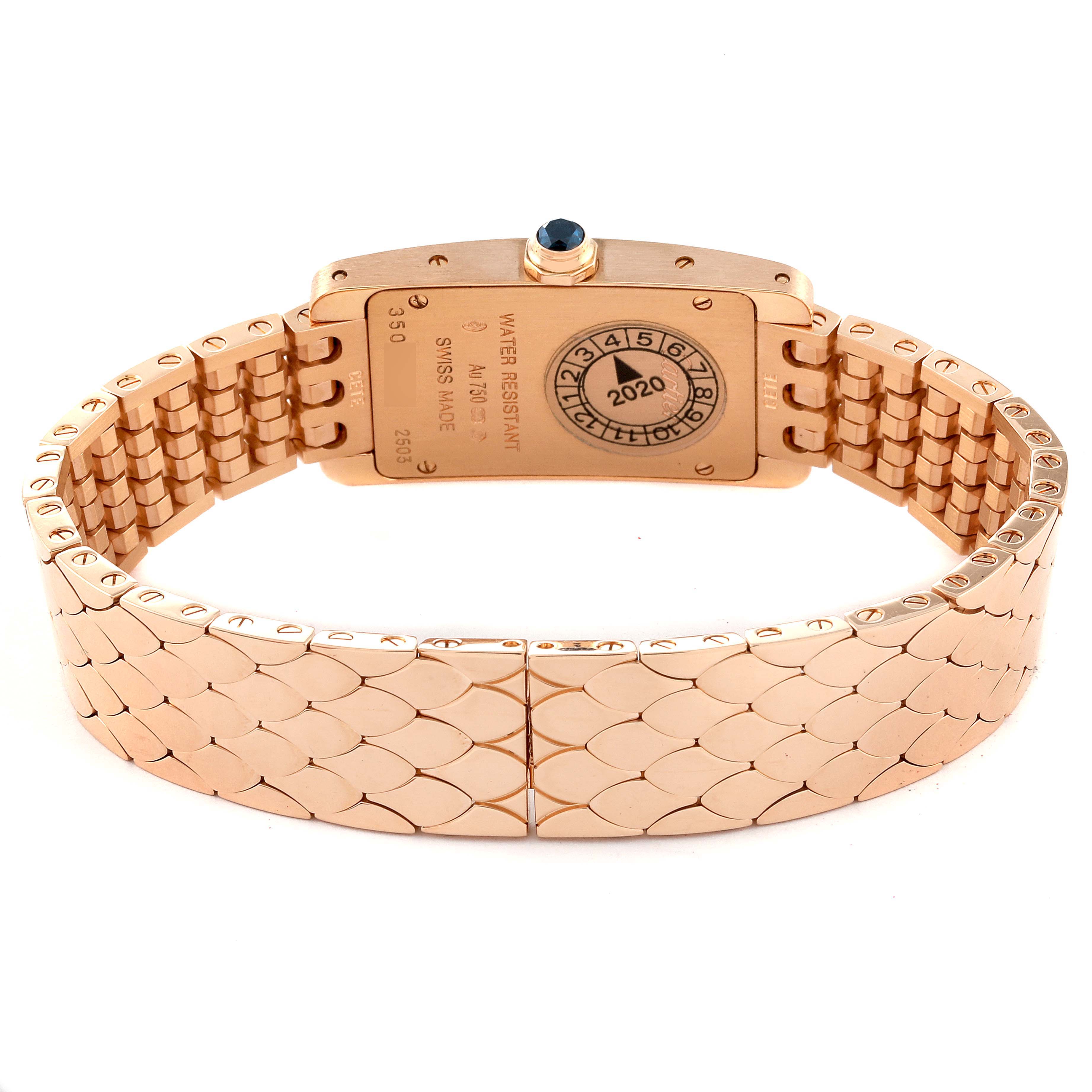 The image displays the back view of the Cartier Tank Americaine W2620031 Women's Rose Gold Silver Dial W2620031 Women's Rose Gold Silver Dial watch, highlighting its case back, serial numbers, and bracelet.