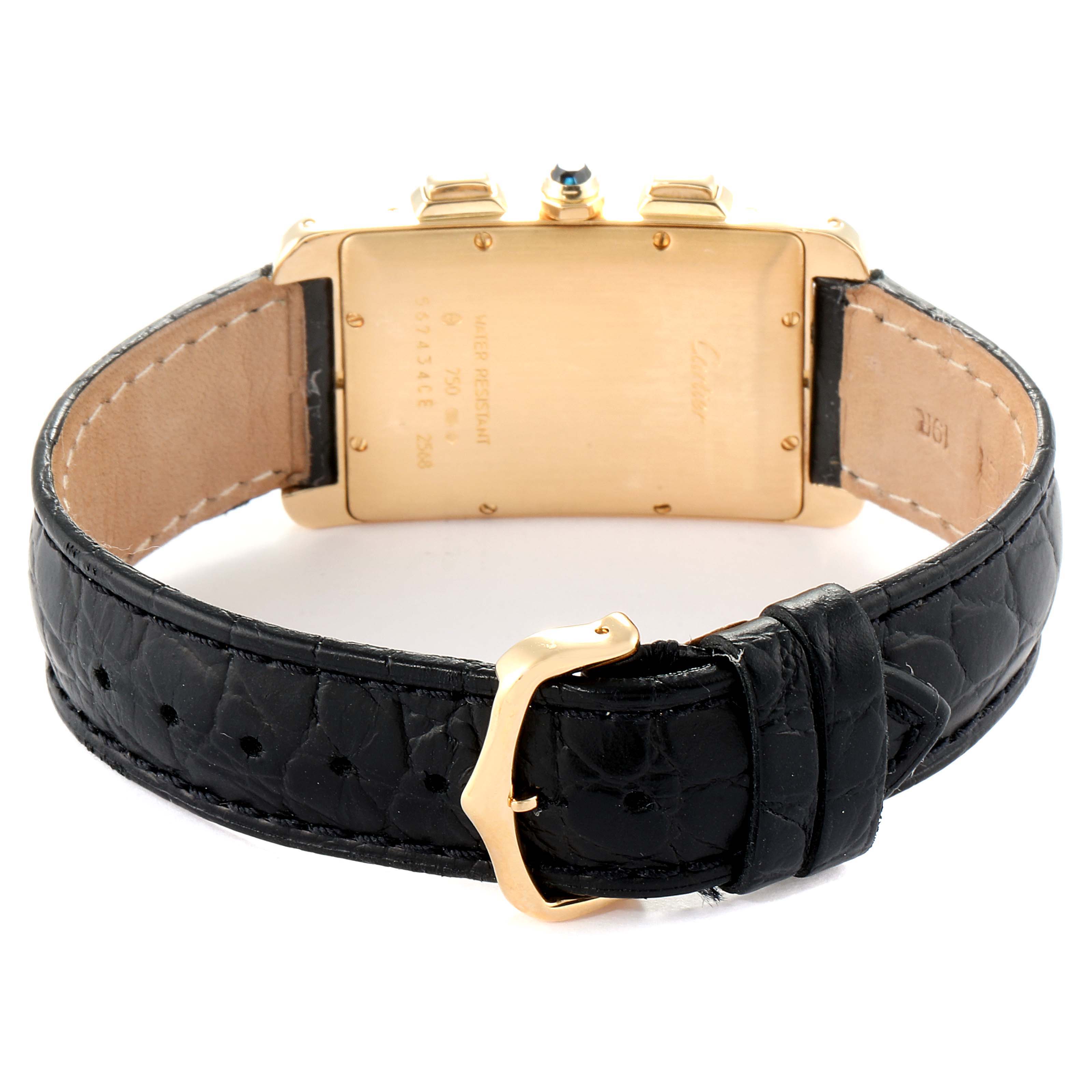 The image shows the back view of a Cartier Tank Americaine 2568 Men
s Yellow Gold Silver Dial 2568 Men
s Yellow Gold Silver Dial watch, including the case back and black leather strap with a gold buckle.