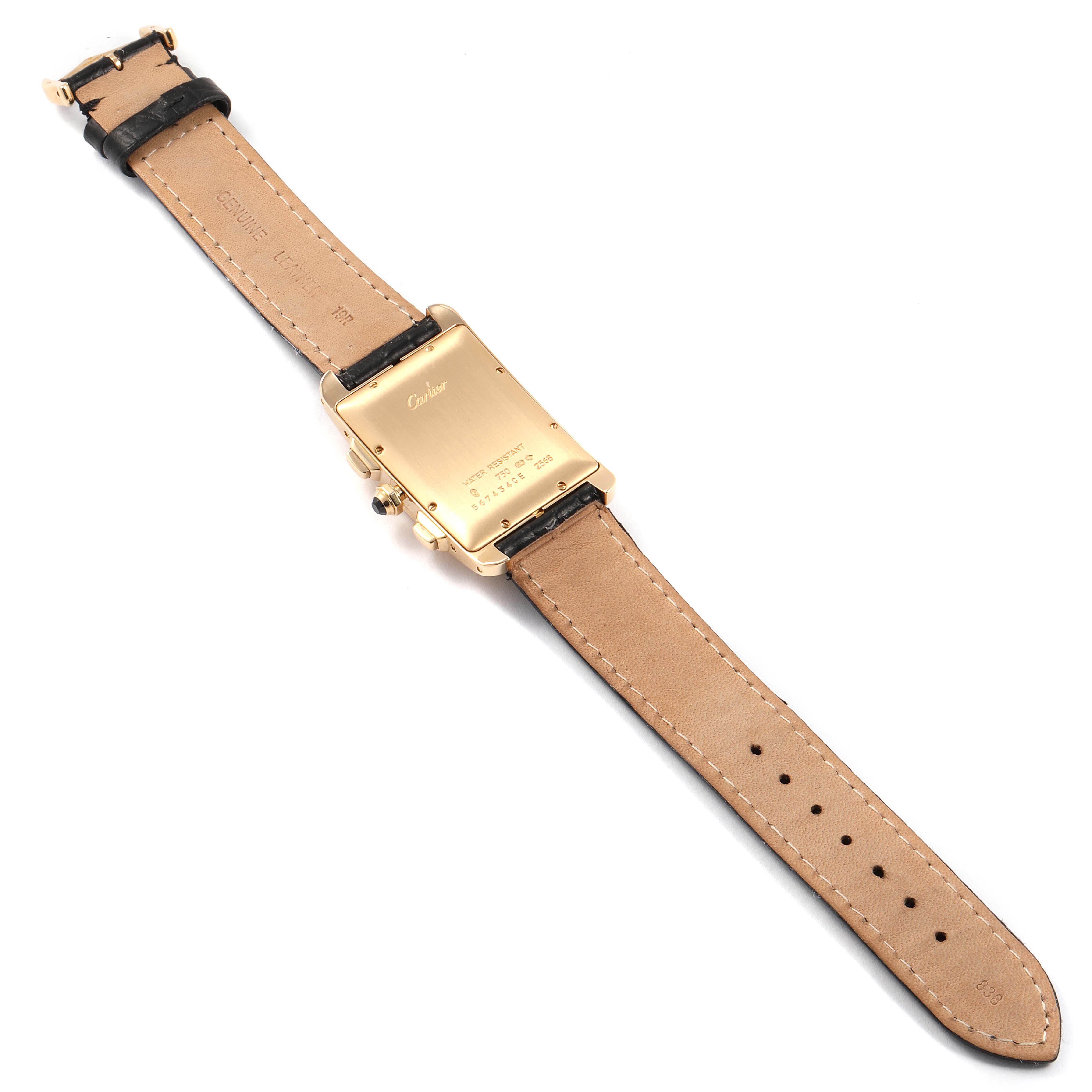 The image shows the back view of a Cartier Tank Americaine 2568 Men
s Yellow Gold Silver Dial 2568 Men
s Yellow Gold Silver Dial watch, highlighting the case back and leather strap.