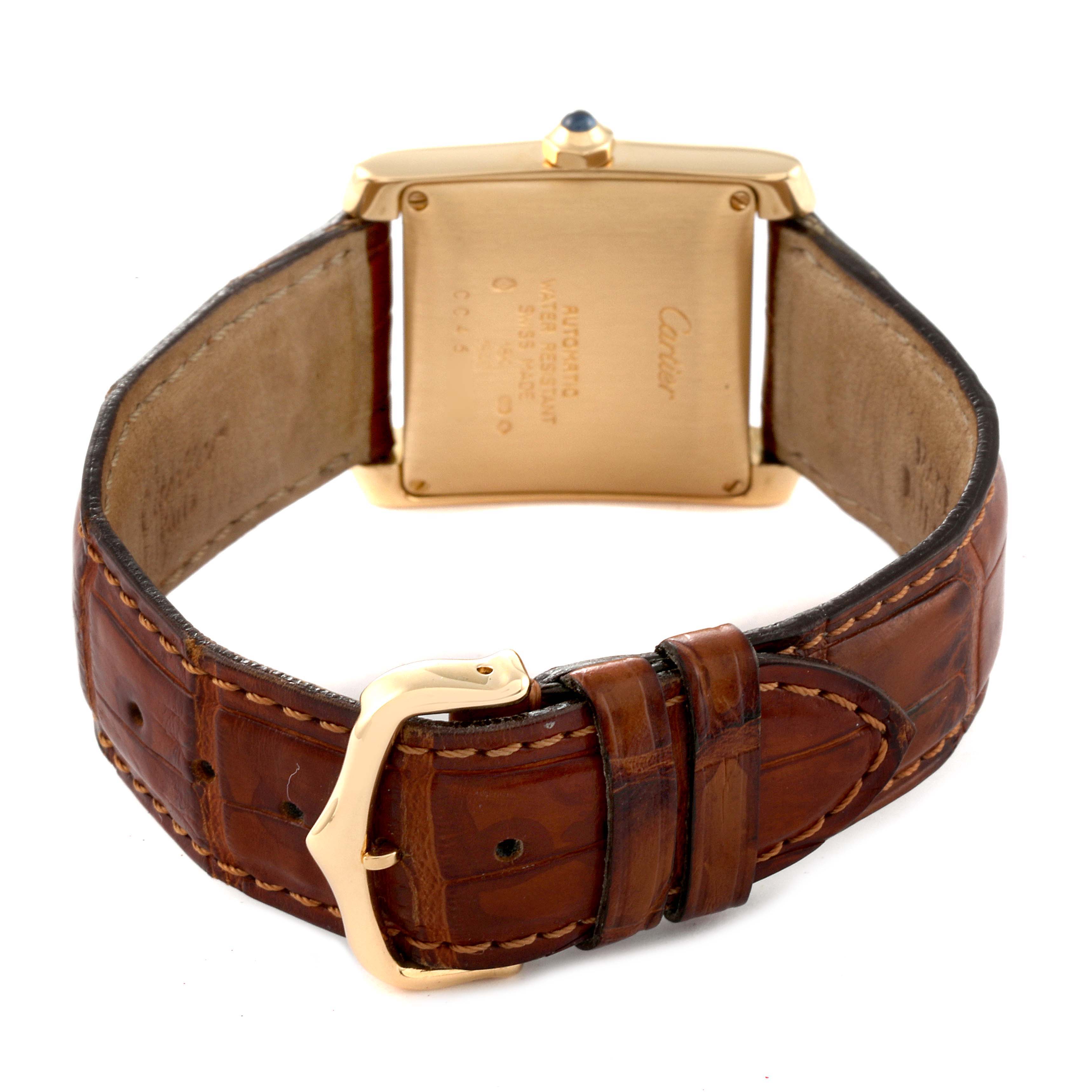 This image shows the back side of a Cartier Tank Française watch with a brown leather strap and a visible buckle.
