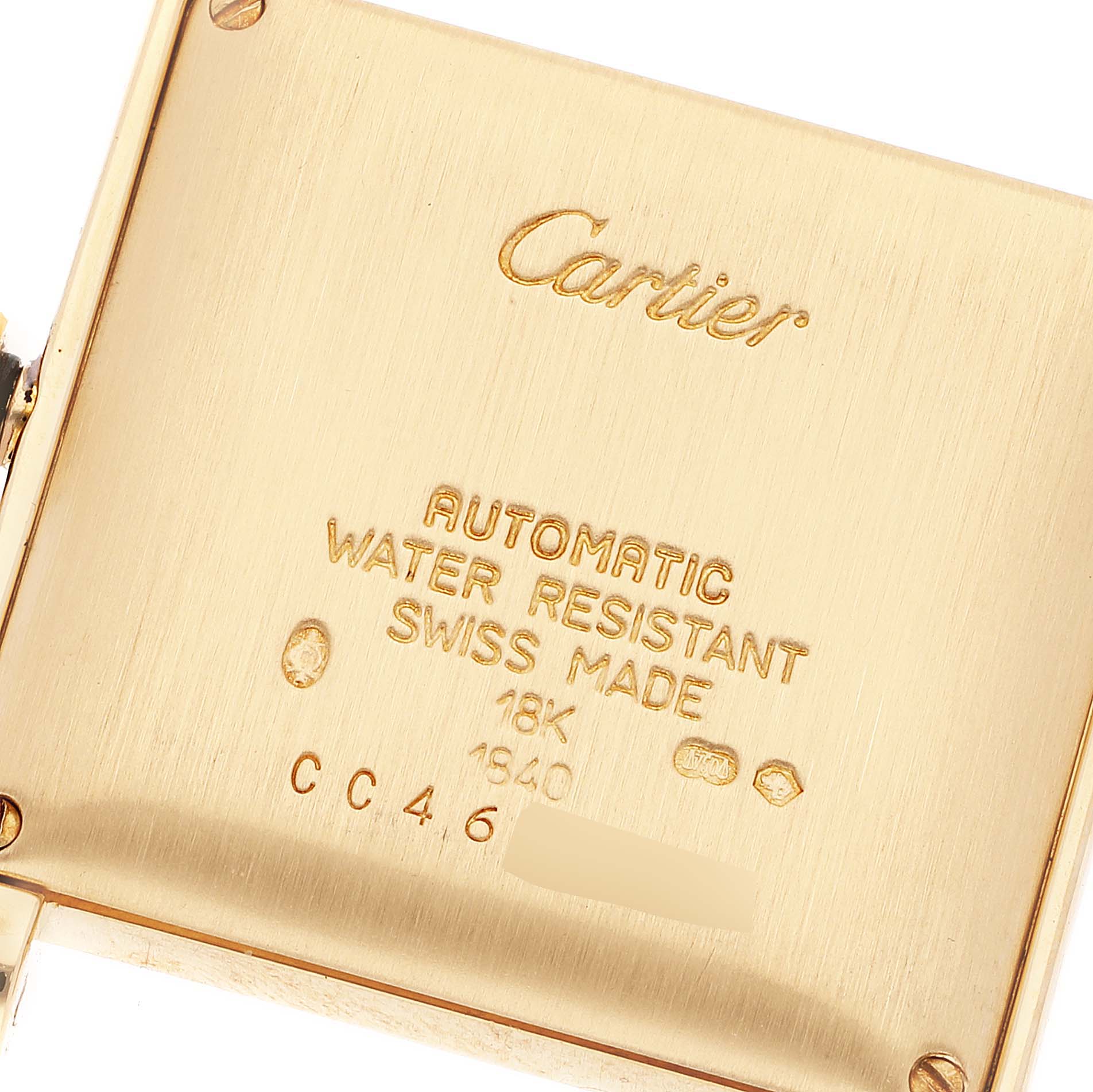 This image shows the back of a Tank Francaise Cartier watch, highlighting inscriptions such as "AUTOMATIC" and "WATER RESISTANT."