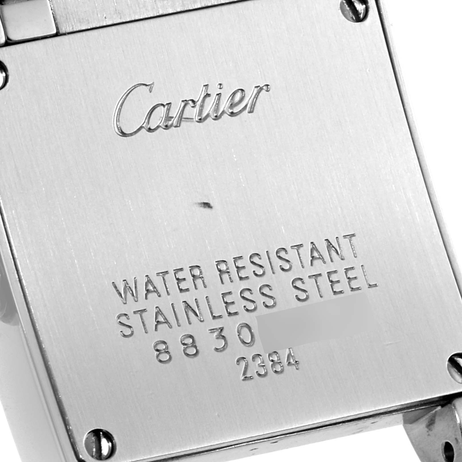 This image shows the back of the Cartier Tank Francaise W51008Q3 Women's Stainless Steel Silver Dial W51008Q3 Women's Stainless Steel Silver Dial watch, displaying engraved brand information and material details.