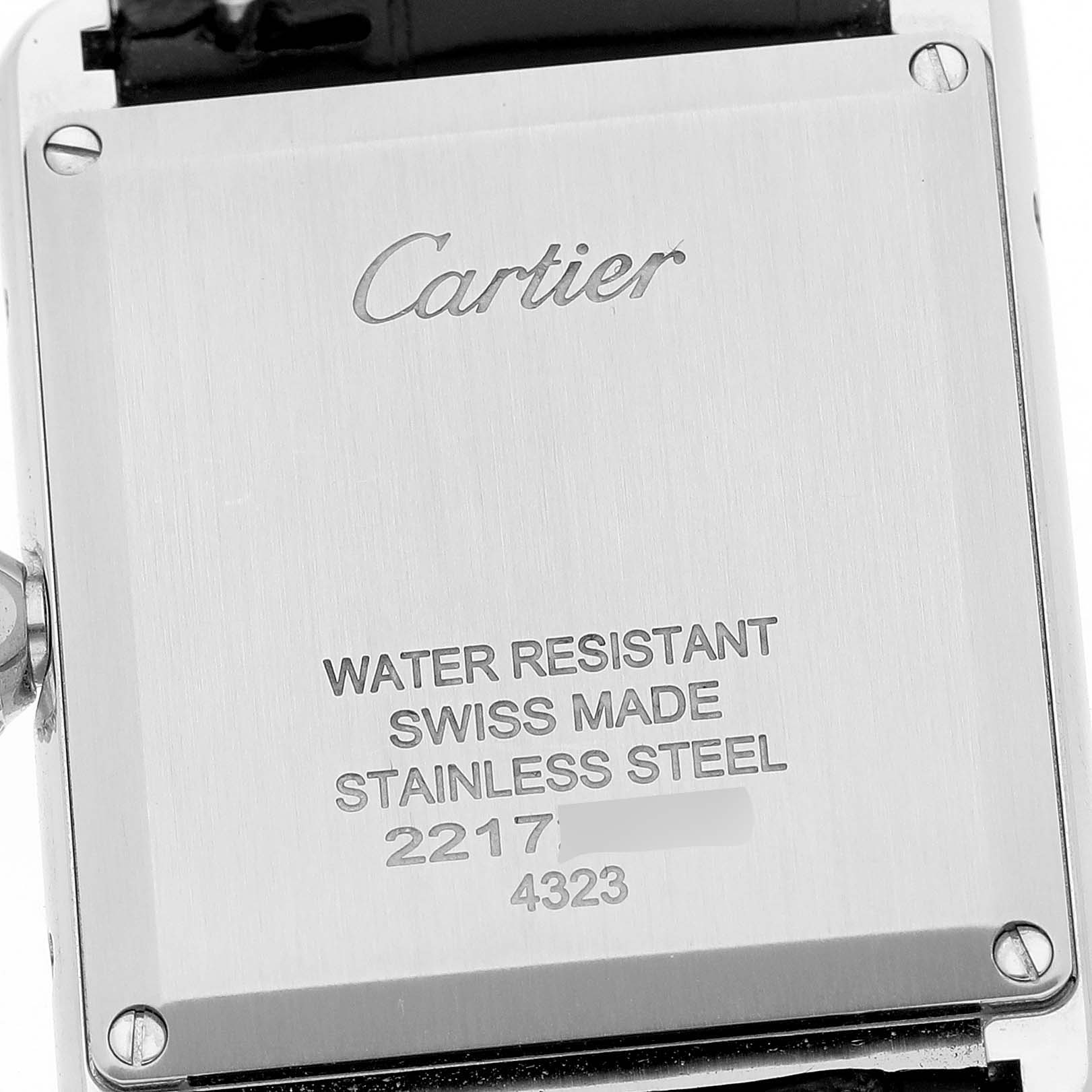 This is the back view of a Cartier Tank Must WSTA0072 Women
s Stainless Steel Black Dial WSTA0072 Women
s Stainless Steel Black Dial watch, showing the engraving details and materials of construction.