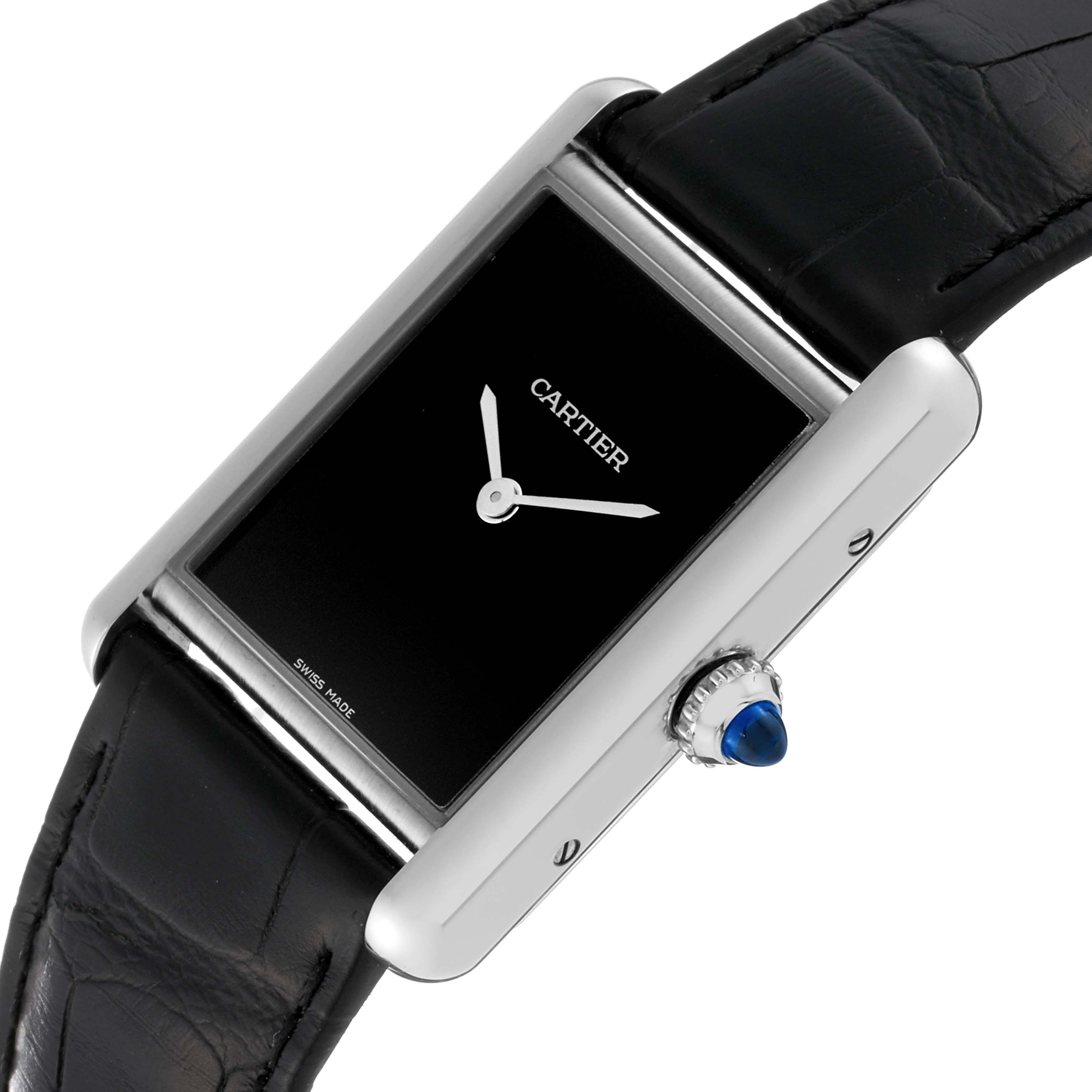 This image shows a Cartier Tank Must WSTA0072 Women
s Stainless Steel Black Dial WSTA0072 Women
s Stainless Steel Black Dial watch from a tilted side view, highlighting the crown and black dial.