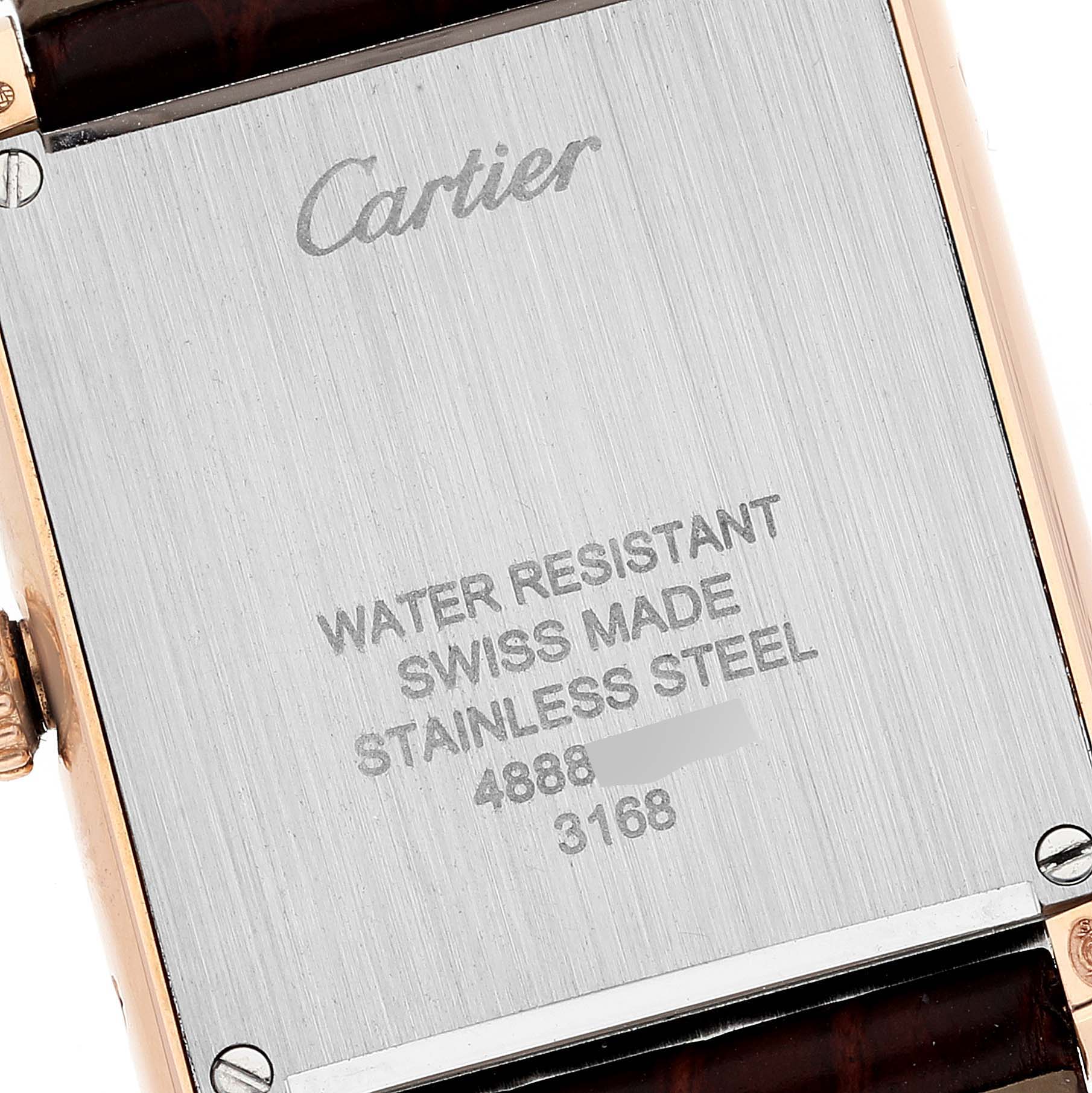 The image shows the back case of a Cartier Tank Solo W5200024 Women's Rose Gold Silver Dial W5200024 Women's Rose Gold Silver Dial watch, highlighting its engraving and stainless steel material.