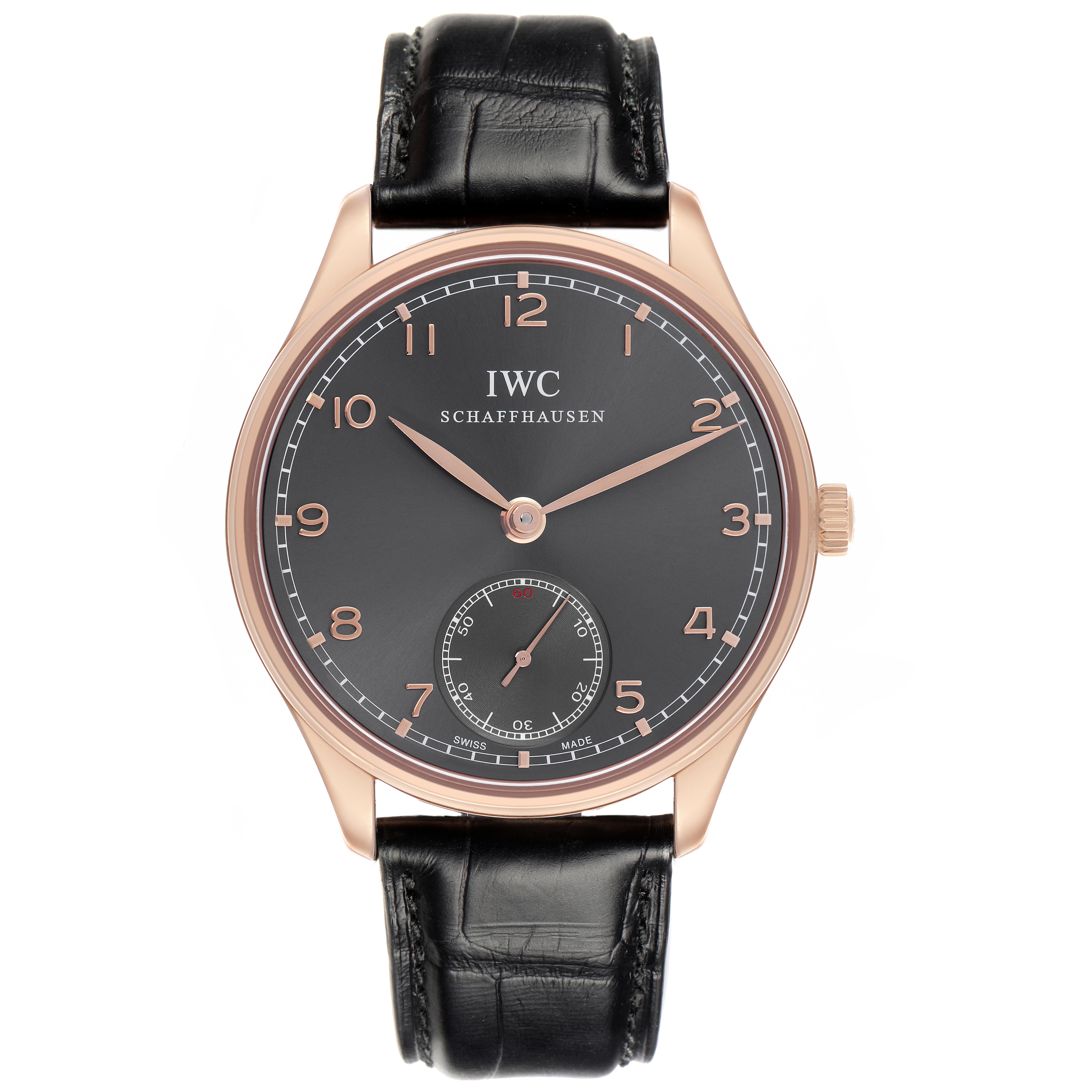 The IWC Portuguese IW545406 Men's Rose Gold Grey Dial IW545406 Men's Rose Gold Grey Dial watch is shown from a top-down angle, highlighting the black dial, hands, subdial, case, and strap.
