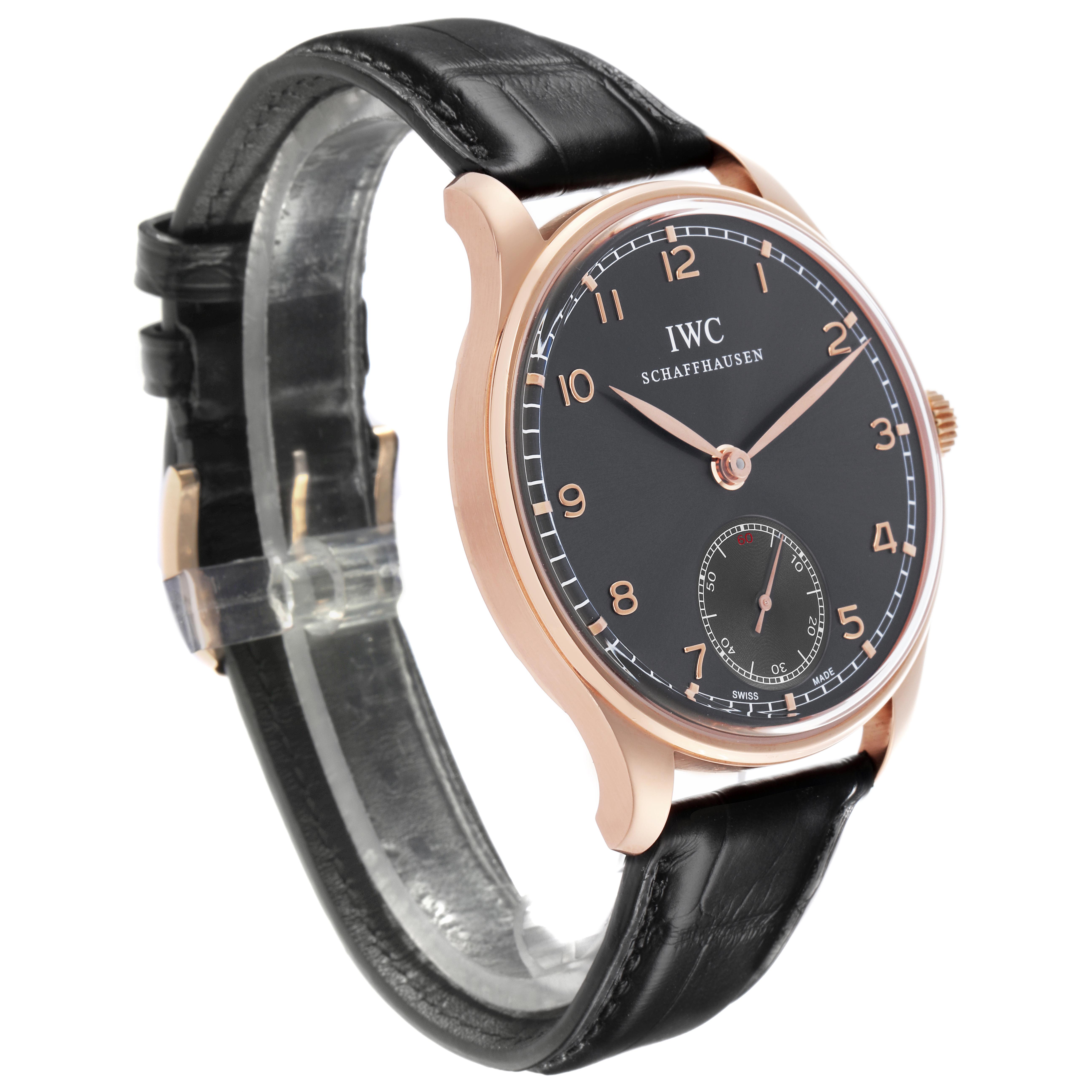 The IWC Portuguese IW545406 Men's Rose Gold Grey Dial IW545406 Men's Rose Gold Grey Dial watch is shown at a three-quarter angle, displaying the face, casing, and part of the leather strap.