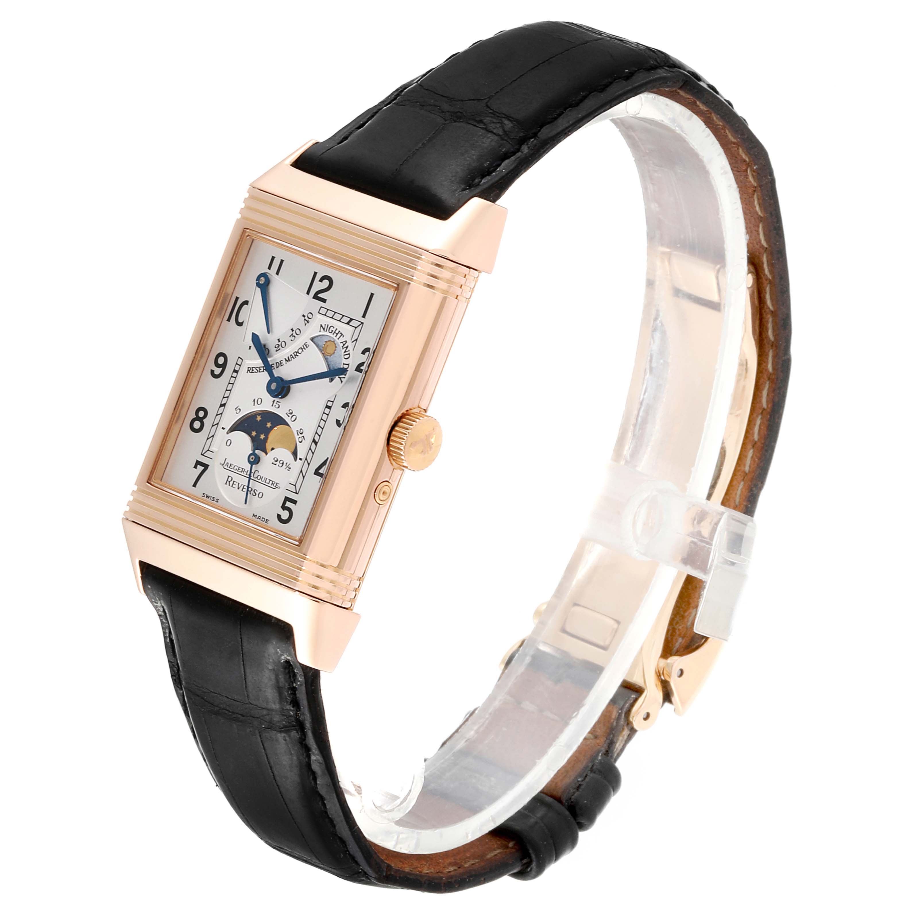 This image shows a Jaeger LeCoultre Reverso Q3042420 Men's Rose Gold Silver Dial Q3042420 Men's Rose Gold Silver Dial watch at a three-quarter angle, highlighting the face, crown, and black leather strap.