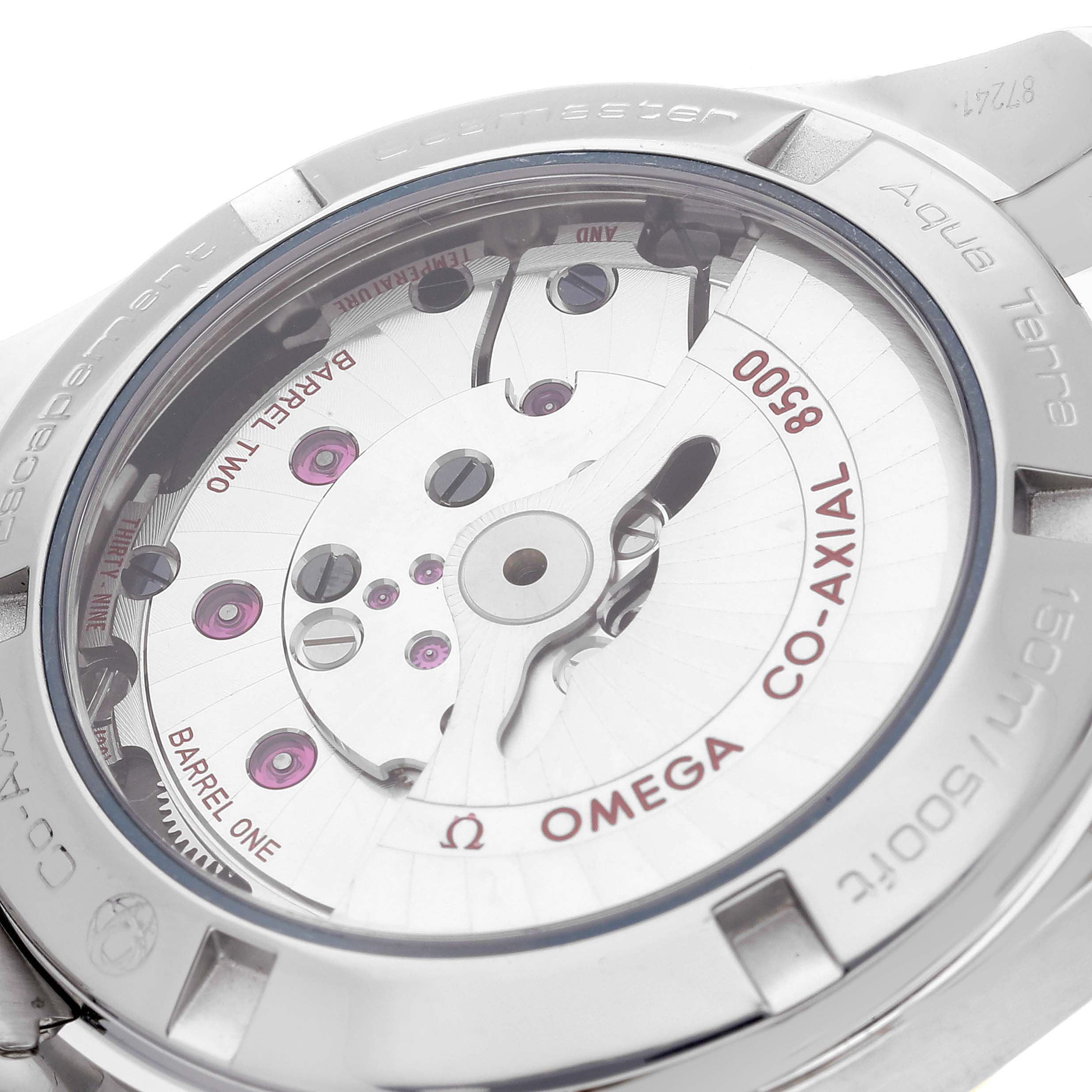 This image shows a close-up view of the back of the Omega Aqua Terra 231.20.39.21.06.004 Men's Steel and Gold (two tone) Grey Dial 231.20.39.21.06.004 Men's Steel and Gold (two tone) Grey Dial watch, highlighting the co-axial movement mechanism.