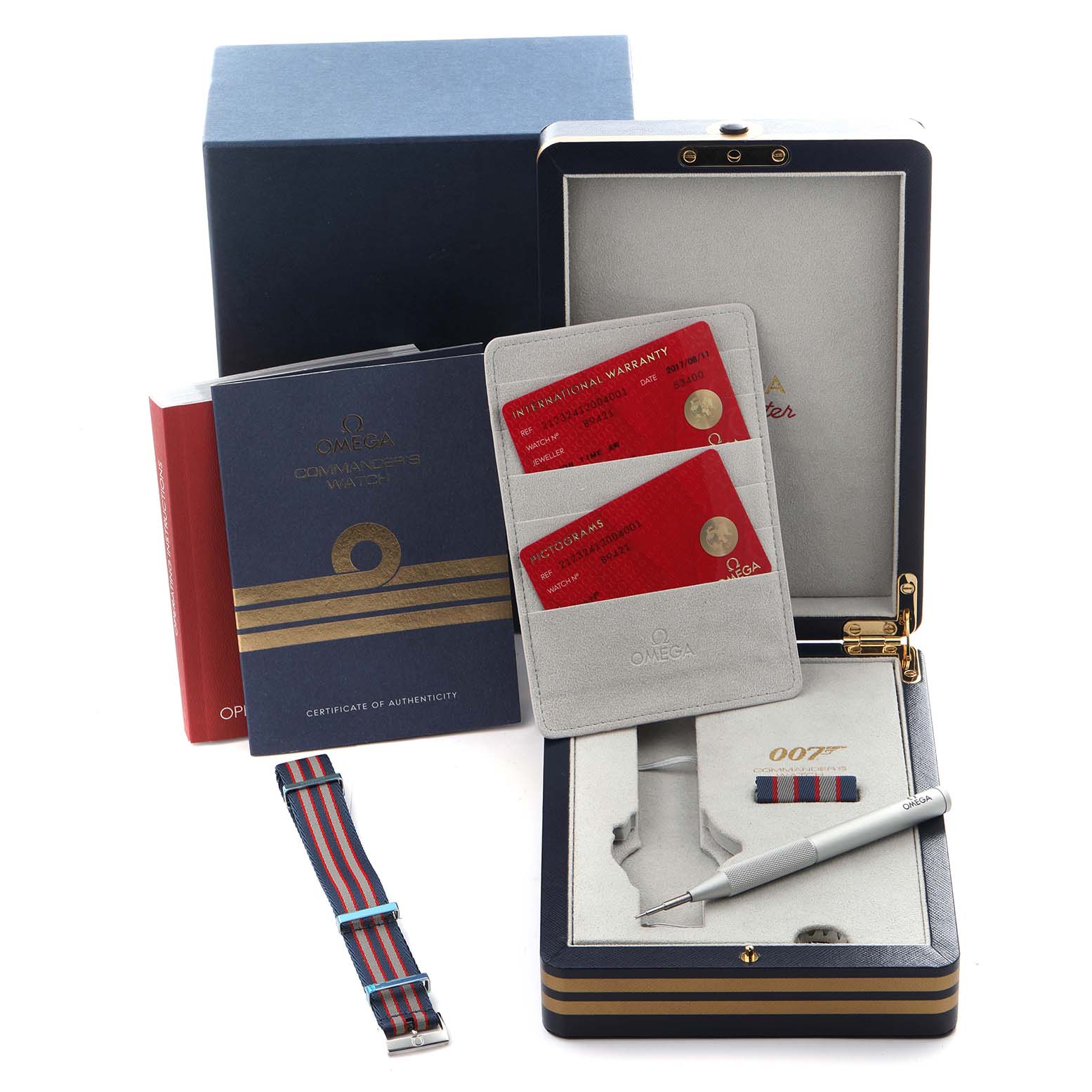 The image shows an Omega Seamaster 212.32.41.20.04.001 Men's Stainless Steel White Dial 212.32.41.20.04.001 Men's Stainless Steel White Dial box, warranty cards, a NATO strap, a tool, and booklets from a top angle.