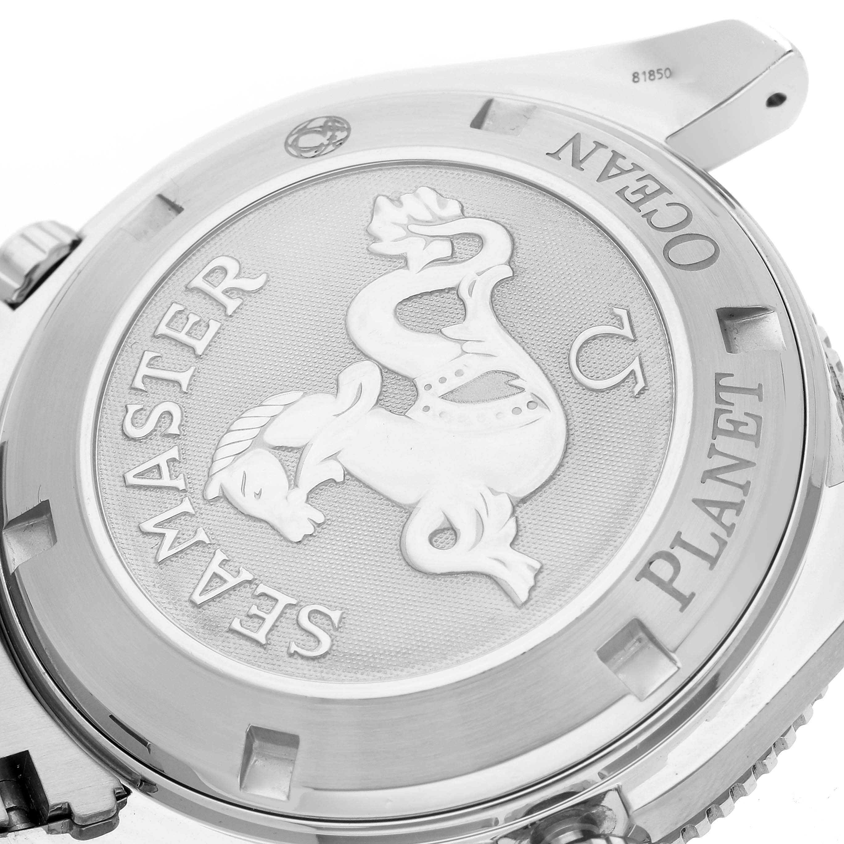 The image shows the case back of the Omega Seamaster Planet Ocean watch featuring an embossed emblem.