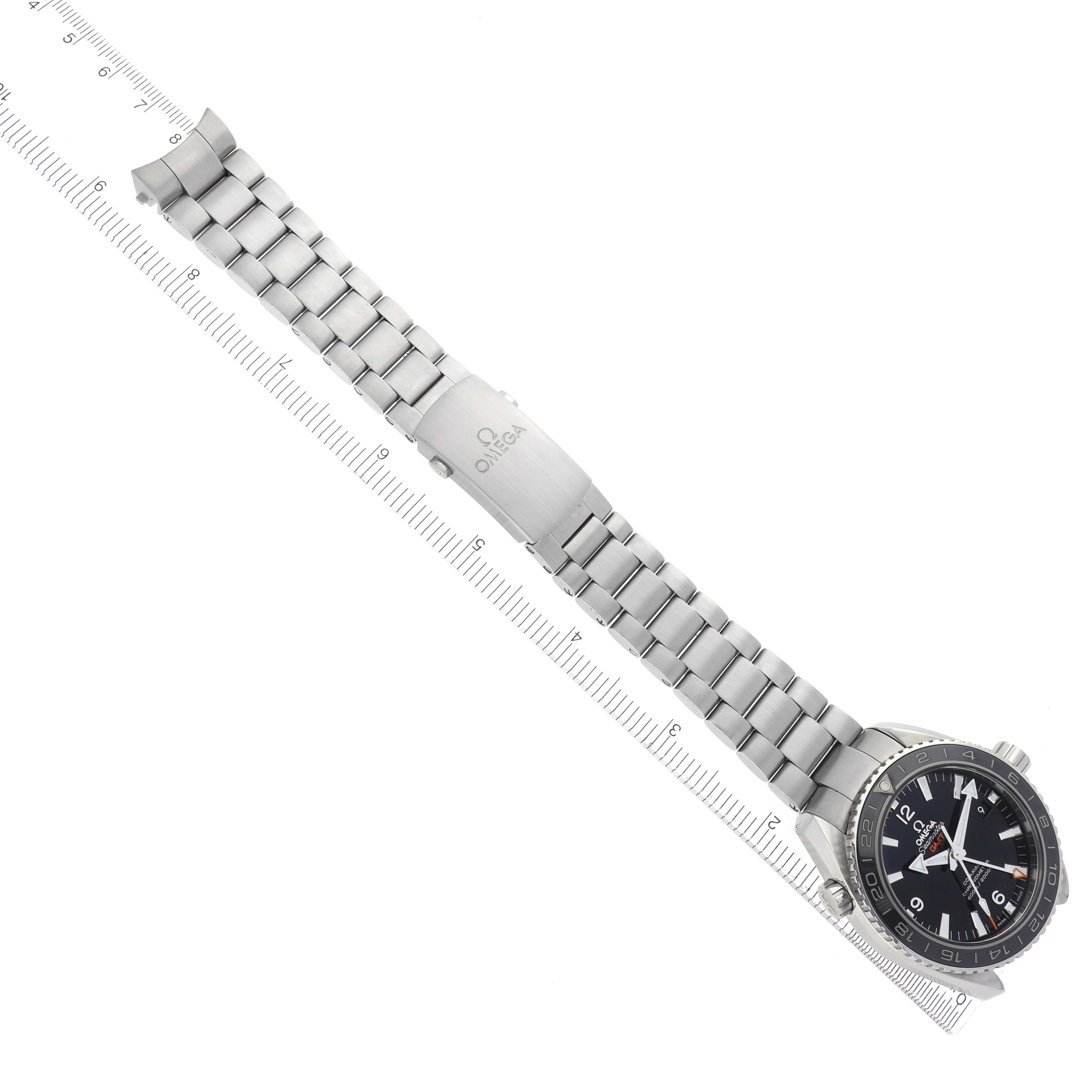 The image shows the Omega Planet Ocean 232.30.44.22.01.001 Men's Stainless Steel Black Dial 232.30.44.22.01.001 Men's Stainless Steel Black Dial watch face, stainless steel bracelet, and clasp at an overhead angle.