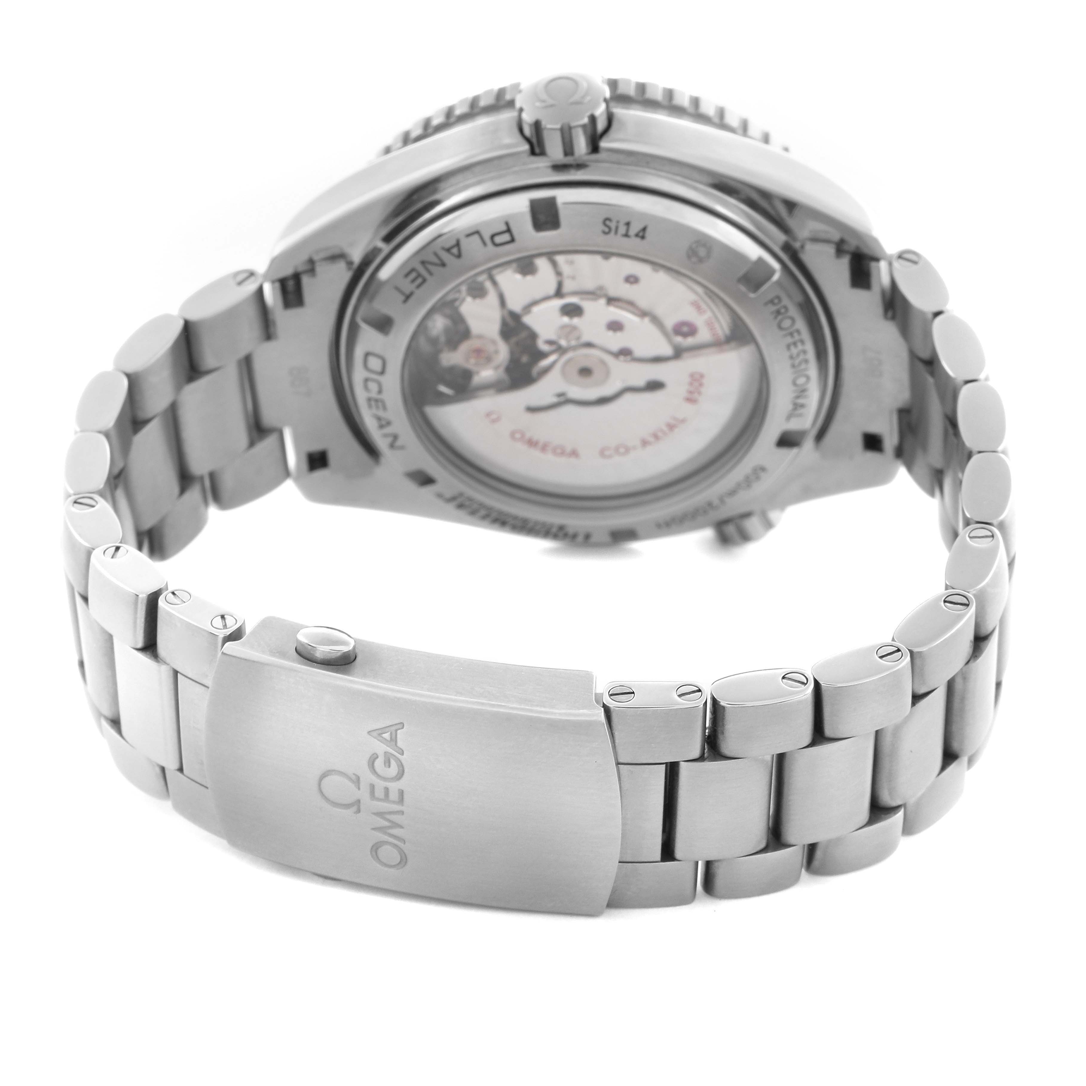 The image shows the back and clasp of the Omega Planet Ocean 232.90.46.21.03.001 Men's Titanium Blue Dial 232.90.46.21.03.001 Men's Titanium Blue Dial watch, highlighting its transparent case back and metal bracelet.