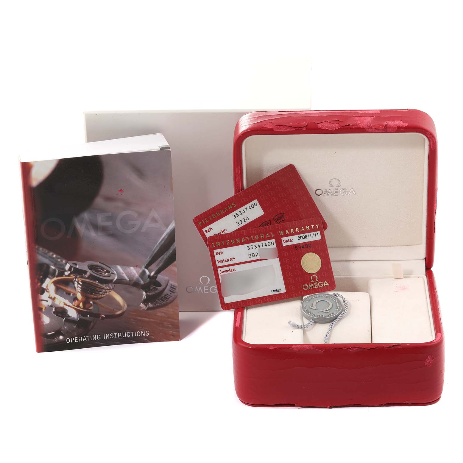 The image shows an Omega Speedmaster 3534.74.00 Men's Stainless Steel Mother of Pearl Dial 3534.74.00 Men's Stainless Steel Mother of Pearl Dial watch box, international warranty cards, and instruction manual.