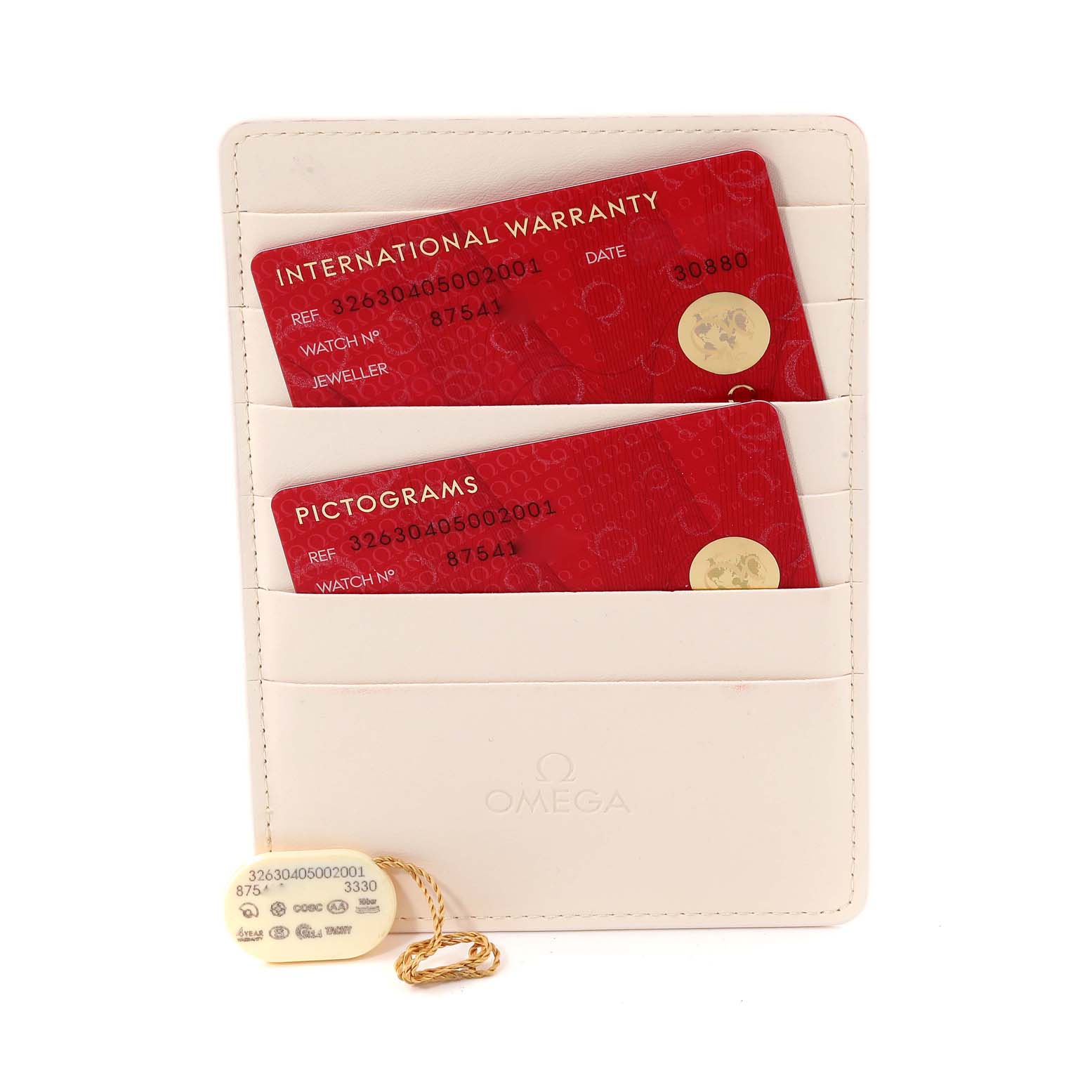 The image shows warranty cards and a tag for an Omega Speedmaster 326.30.40.50.02.001 Men's Stainless Steel Silver Dial 326.30.40.50.02.001 Men's Stainless Steel Silver Dial model, stored in a white cardholder.