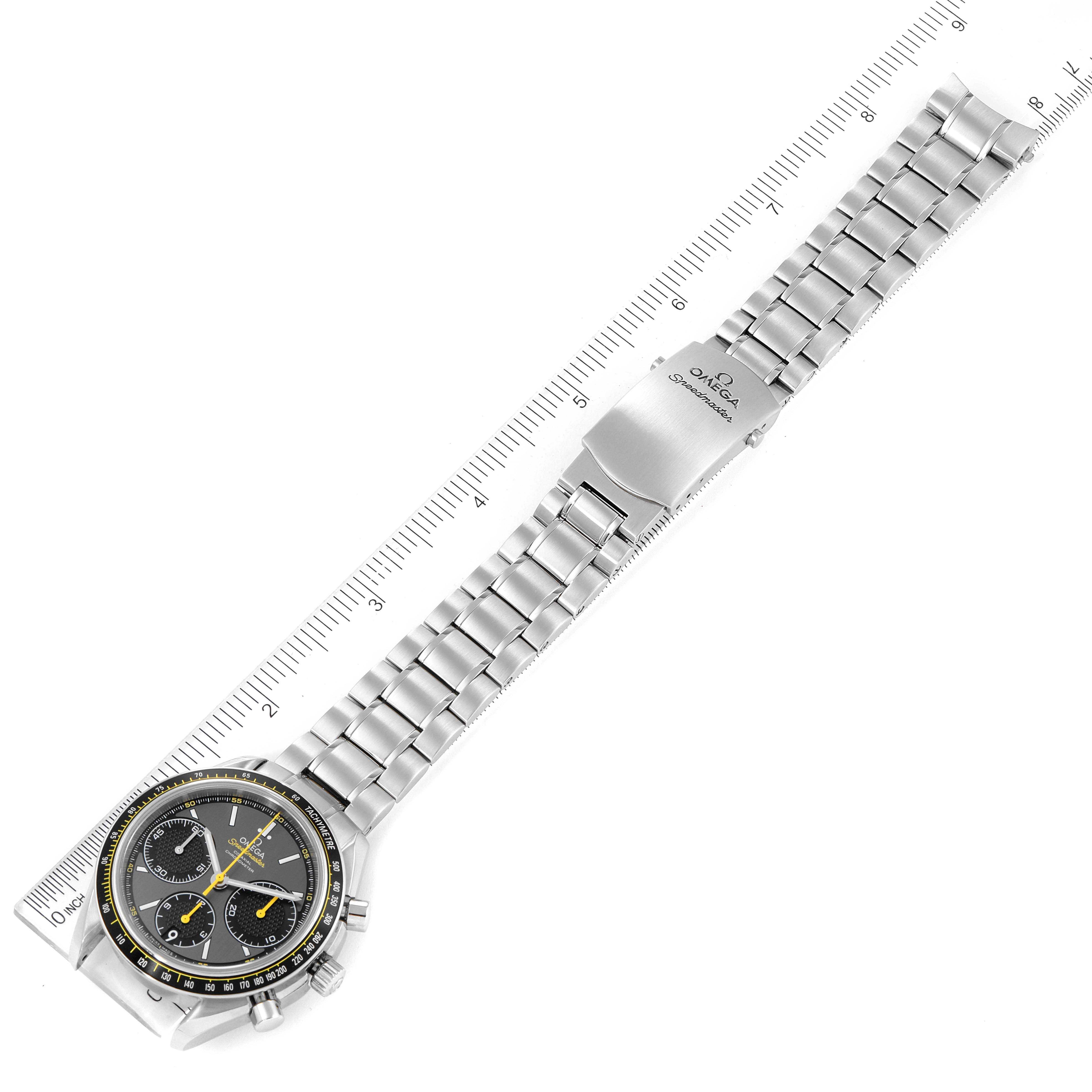 This image shows the Omega Speedmaster 326.30.40.50.06.001 Men
s Stainless Steel Grey Dial 326.30.40.50.06.001 Men
s Stainless Steel Grey Dial watch at a slight angle with its full metal bracelet and clasp visible, measured by a ruler.