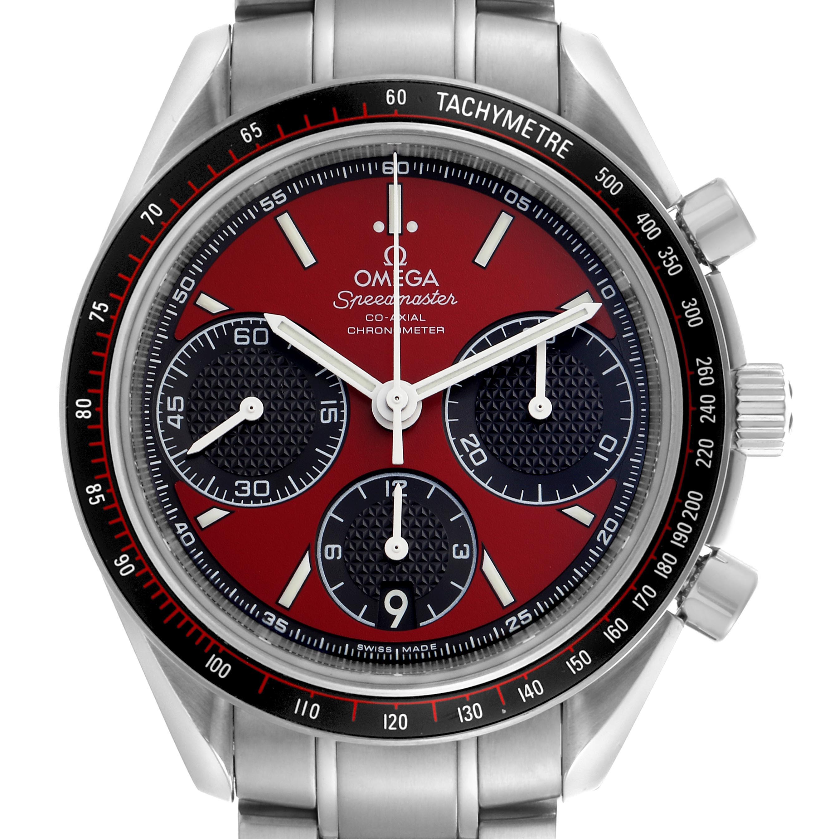 The image shows a frontal view of the Omega Speedmaster 326.30.40.50.11.001 Men's Stainless Steel Red Dial 326.30.40.50.11.001 Men's Stainless Steel Red Dial, highlighting its dial, tachymeter, subdials, and crown.