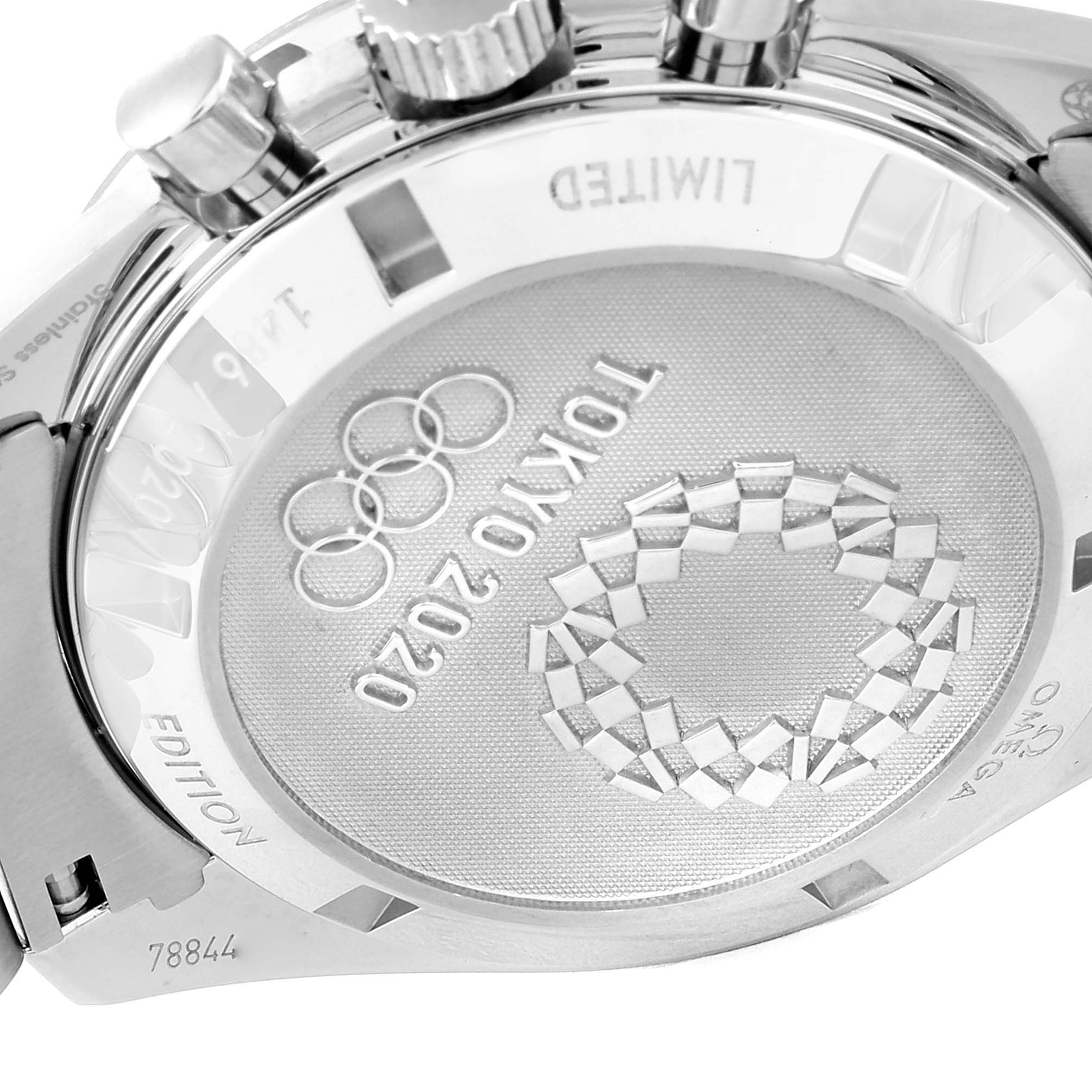 The image shows the back case of an Omega Speedmaster 522.30.42.30.04.001 Men's Stainless Steel White Dial 522.30.42.30.04.001 Men's Stainless Steel White Dial watch, featuring Tokyo 2020 Olympic engravings.
