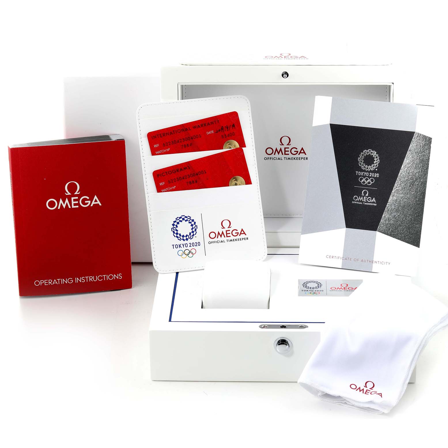 This image shows the Omega Speedmaster 522.30.42.30.04.001 Men's Stainless Steel White Dial 522.30.42.30.04.001 Men's Stainless Steel White Dial watch packaging, including an instruction manual, authenticity cards, and a cleaning cloth.