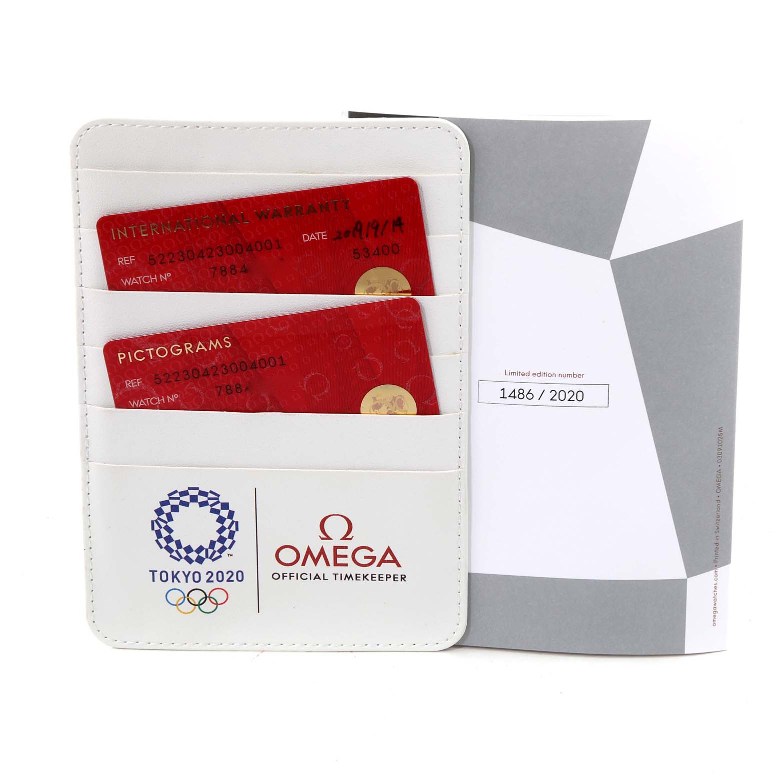 The image shows the warranty cards and limited edition certificate for the Omega Speedmaster 522.30.42.30.04.001 Men's Stainless Steel White Dial 522.30.42.30.04.001 Men's Stainless Steel White Dial watch.