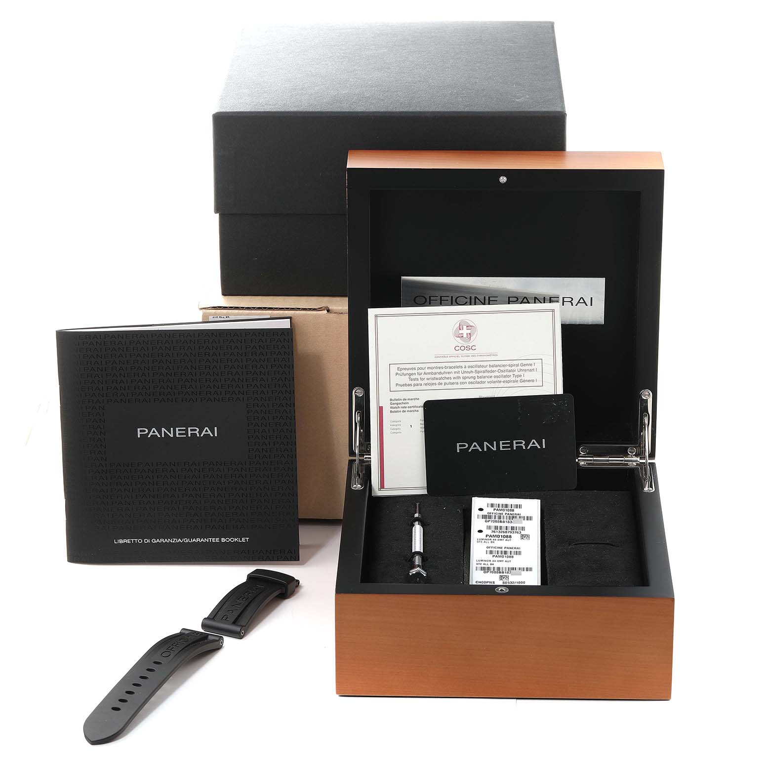 This image shows the packaging for a Panerai Luminor PAM01088 Men
s Stainless Steel Black Dial PAM01088 Men
s Stainless Steel Black Dial watch with accessories including a spare strap, tools, and documentation.