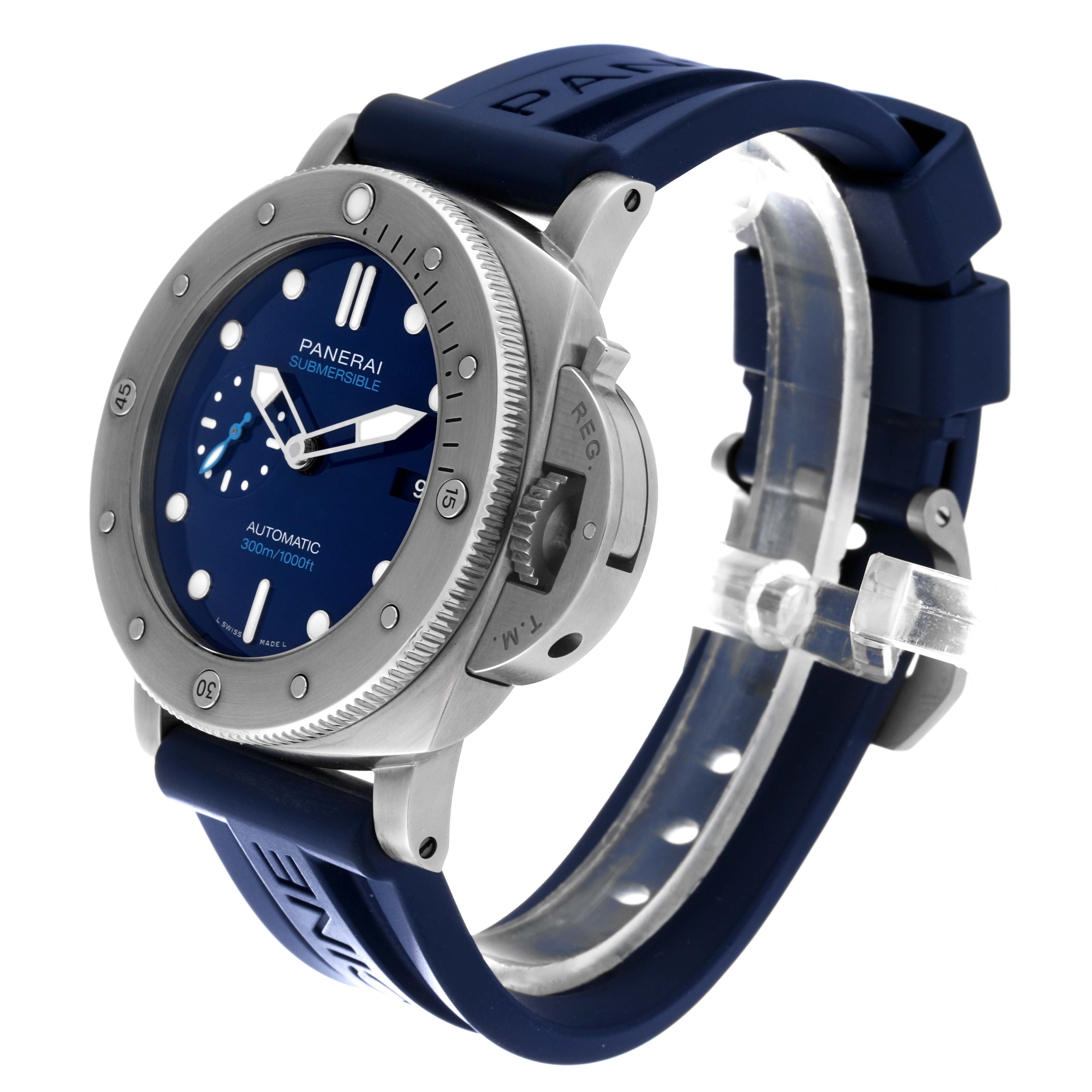 The image shows a side-angle view of the Panerai Submersible PAM00692 Men
s Titanium Blue Dial PAM00692 Men
s Titanium Blue Dial watch, highlighting the blue dial, bezel, crown guard, and rubber strap.