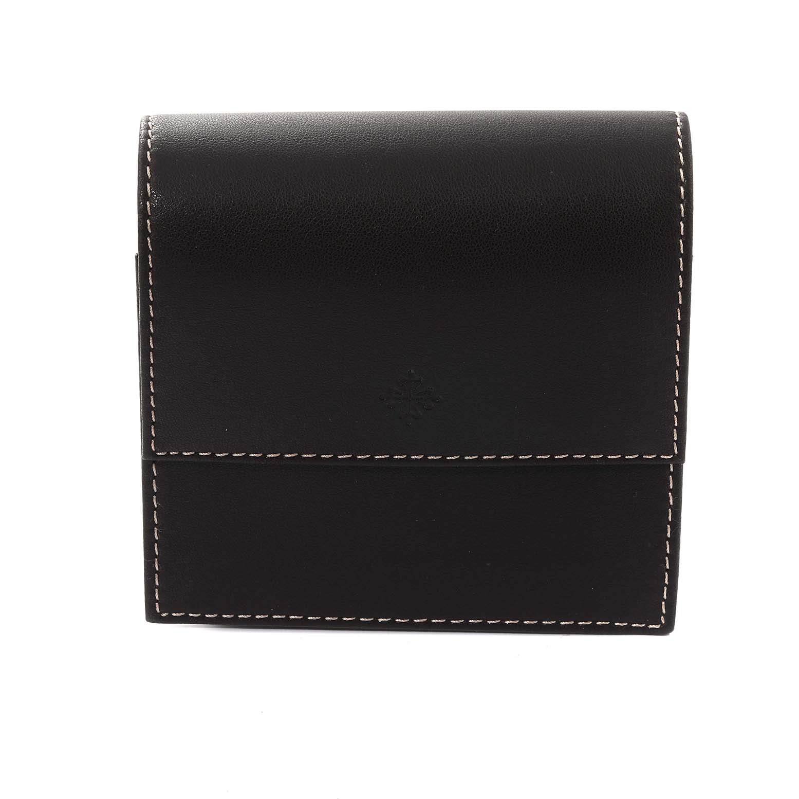 This is a vertical view of a Patek Philippe Complications 5036/1 Men
s White Gold Silver Dial 5036/1 Men
s White Gold Silver Dial model watch case, showing the front flap and stitching.