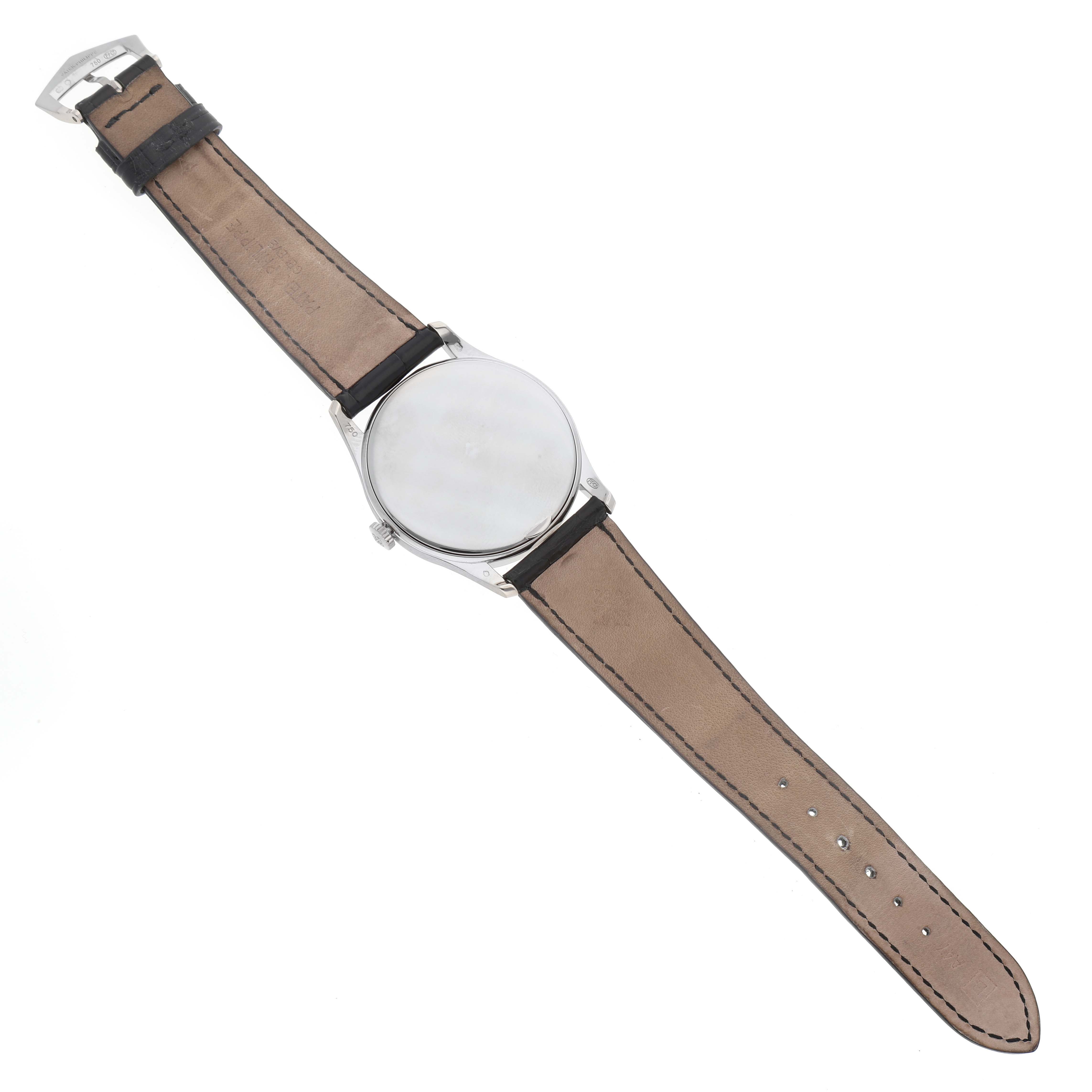 The image displays a top-down view of a Patek Philippe Calatrava 5196G Men
s White Gold Silver Dial 5196G Men
s White Gold Silver Dial watch showcasing its strap, case, and buckle.