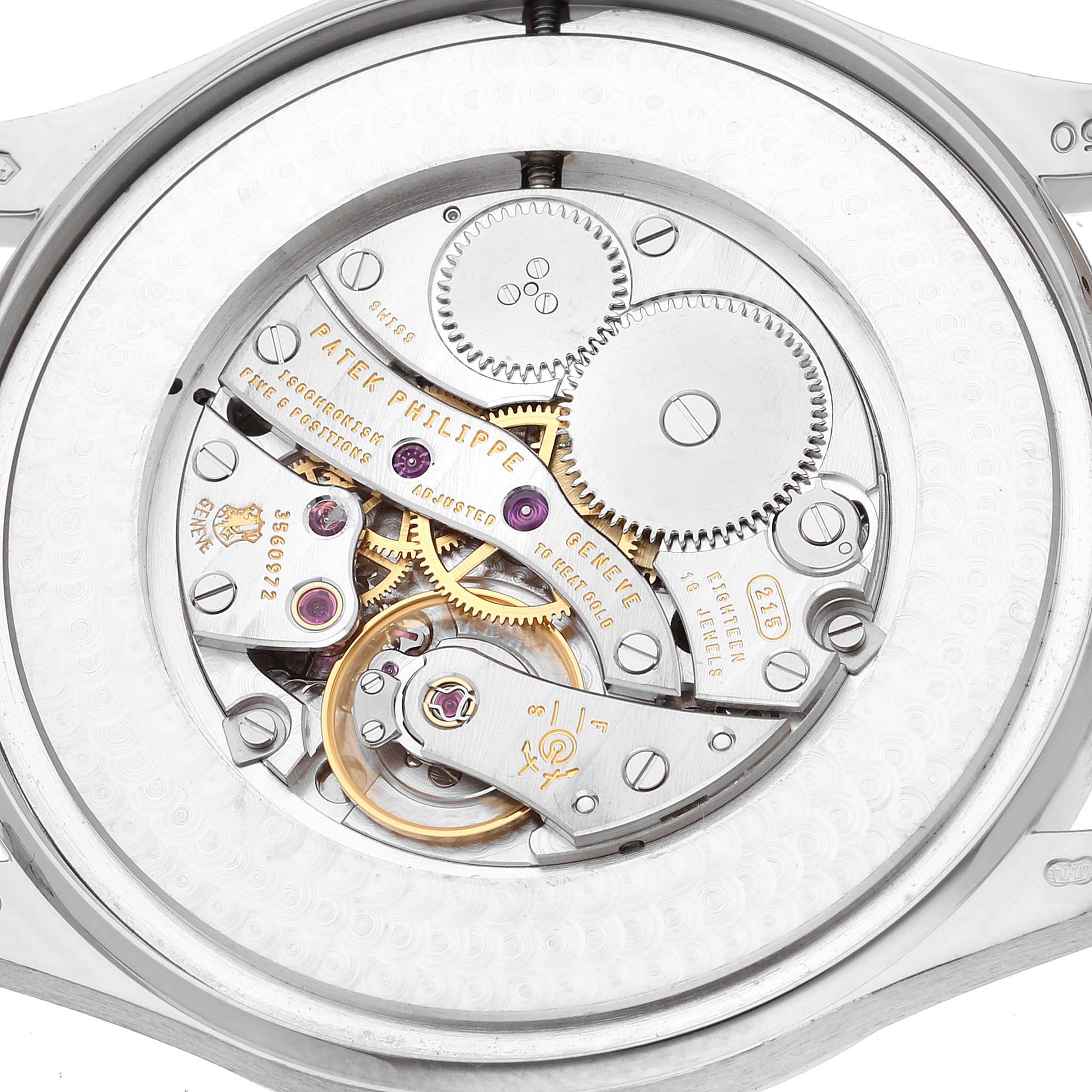 The image shows the movement and inner mechanics of a Patek Philippe Calatrava 5196G Men
s White Gold Silver Dial 5196G Men
s White Gold Silver Dial watch viewed from the back.