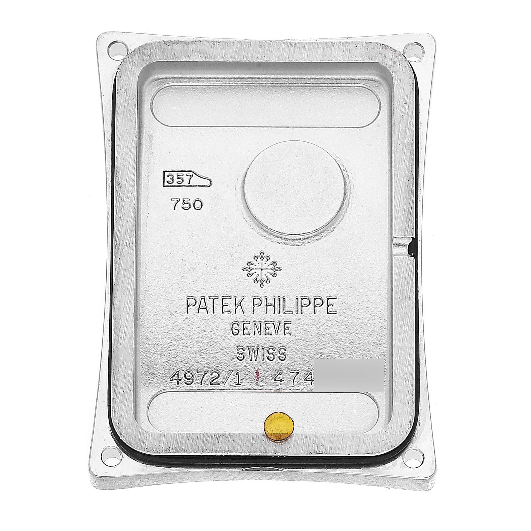 This image shows the back case of a Patek Philippe Gondolo 4972/1G-001 Women's White Gold Mother of Pearl Dial 4972/1G-001 Women's White Gold Mother of Pearl Dial watch, displaying brand markings and model details.