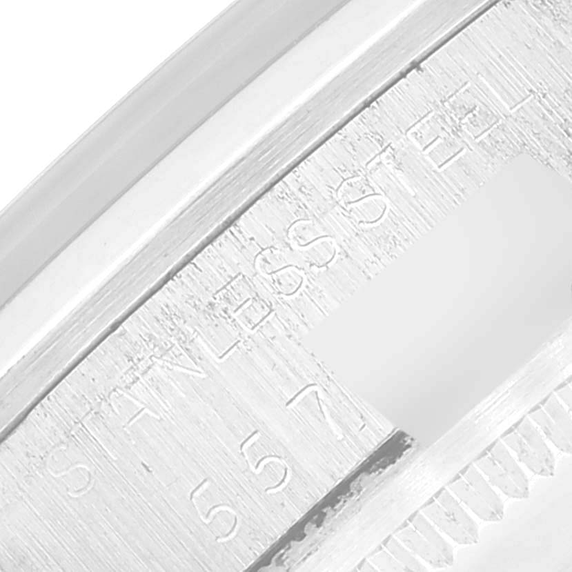 The image shows a close-up of the serial number engraving on the rim of a Rolex Vintage Collection 1500 Men's Stainless Steel Silver Dial 1500 Men's Stainless Steel Silver Dial watch.