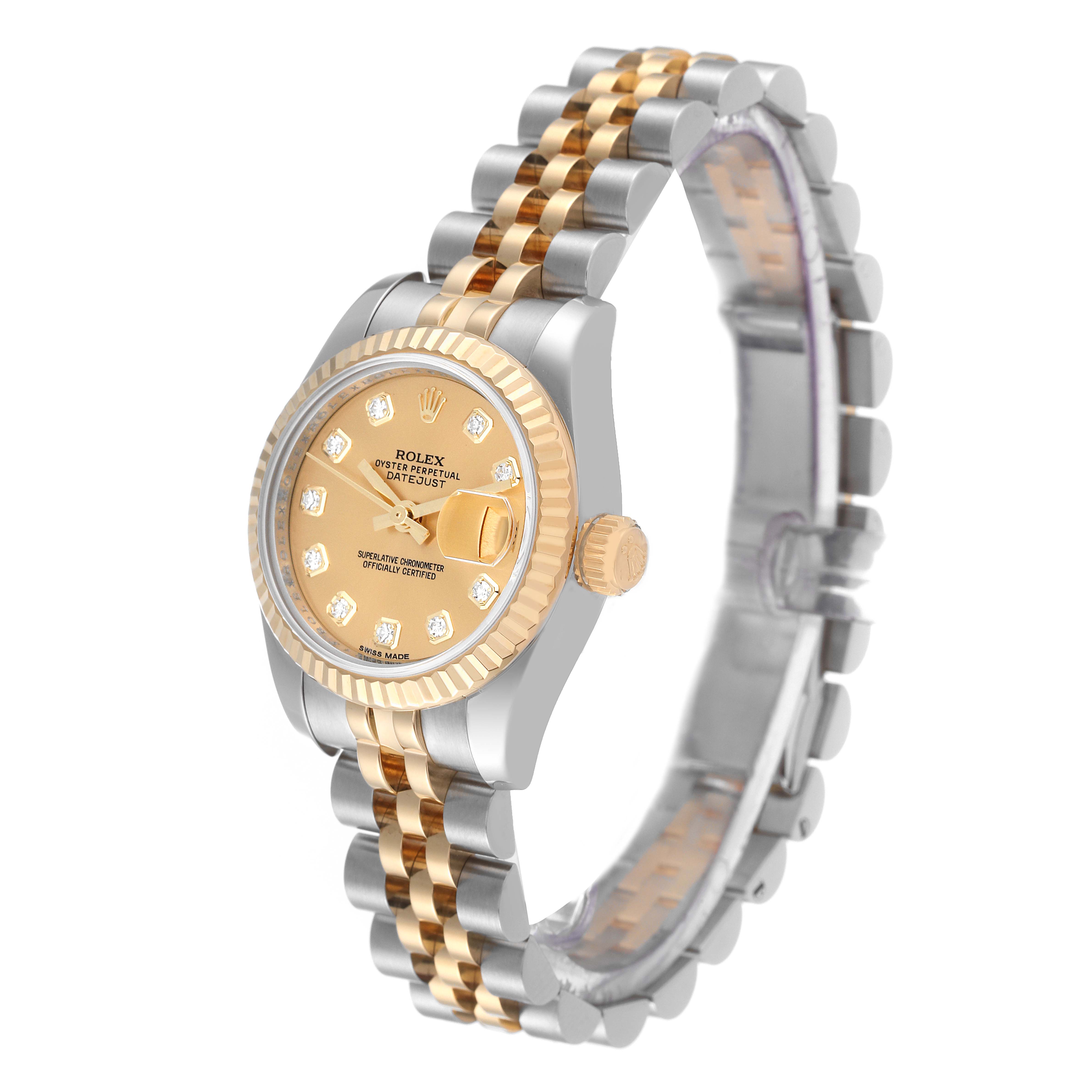 The Rolex Datejust 179173 Women's Steel and Gold (two tone) Champagne Dial 179173 Women's Steel and Gold (two tone) Champagne Dial watch is shown from a side angle, highlighting its face, crown, and two-tone bracelet.