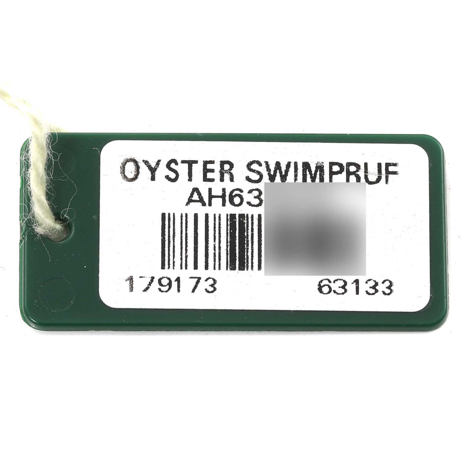 This image shows a Rolex Datejust 179173 Women's Steel and Gold (two tone) Champagne Dial 179173 Women's Steel and Gold (two tone) Champagne Dial model Oyster Swimpruf tag with a barcode and reference numbers.