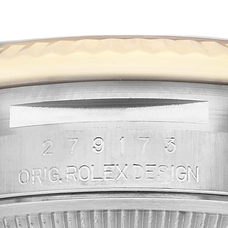 This image shows a close-up of the side of a Rolex Datejust 279173 Women's Steel and Gold (two tone) Champagne Dial 279173 Women's Steel and Gold (two tone) Champagne Dial watch, focusing on the case and serial number.