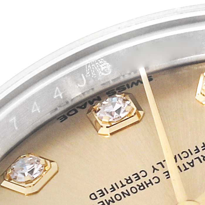 This is a close-up of the dial on a Rolex Datejust 279173 Women's Steel and Gold (two tone) Champagne Dial 279173 Women's Steel and Gold (two tone) Champagne Dial watch, showing diamond hour markers and the "Swiss Made" inscription.
