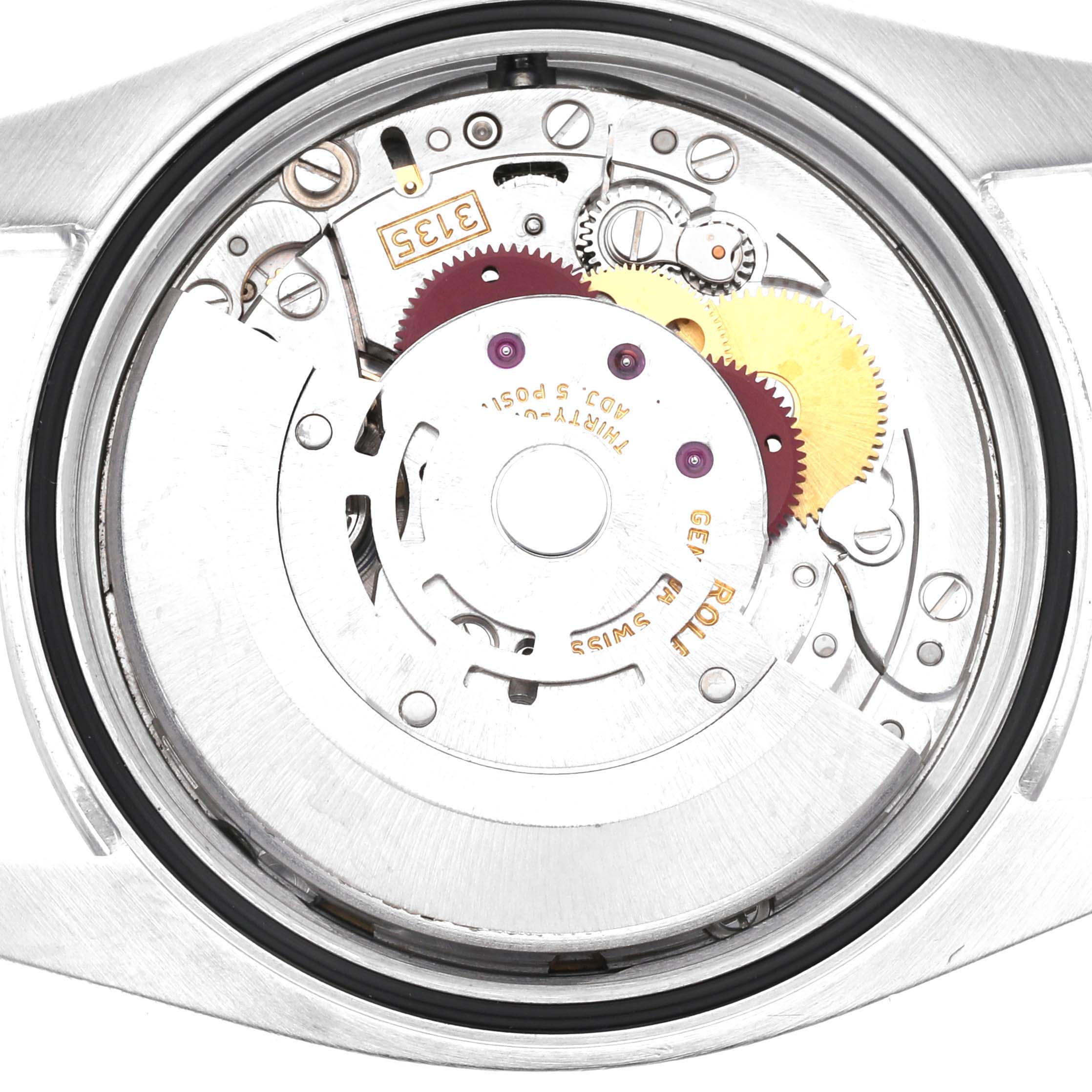 This image shows the intricate movement mechanism of a Rolex Datejust 116200 Men's Stainless Steel Black Dial 116200 Men's Stainless Steel Black Dial watch, viewed from the back.