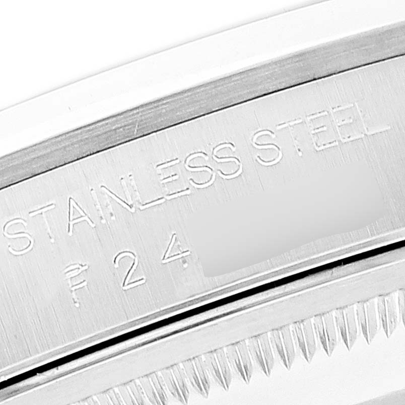 The image shows a close-up of the engraved stainless steel bezel of a Rolex Datejust 16200 Men's Stainless Steel Silver Dial 16200 Men's Stainless Steel Silver Dial watch.