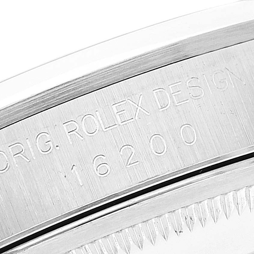 The image shows a close-up of the engraved case back of a Rolex Datejust 16200 Men's Stainless Steel Silver Dial 16200 Men's Stainless Steel Silver Dial model.