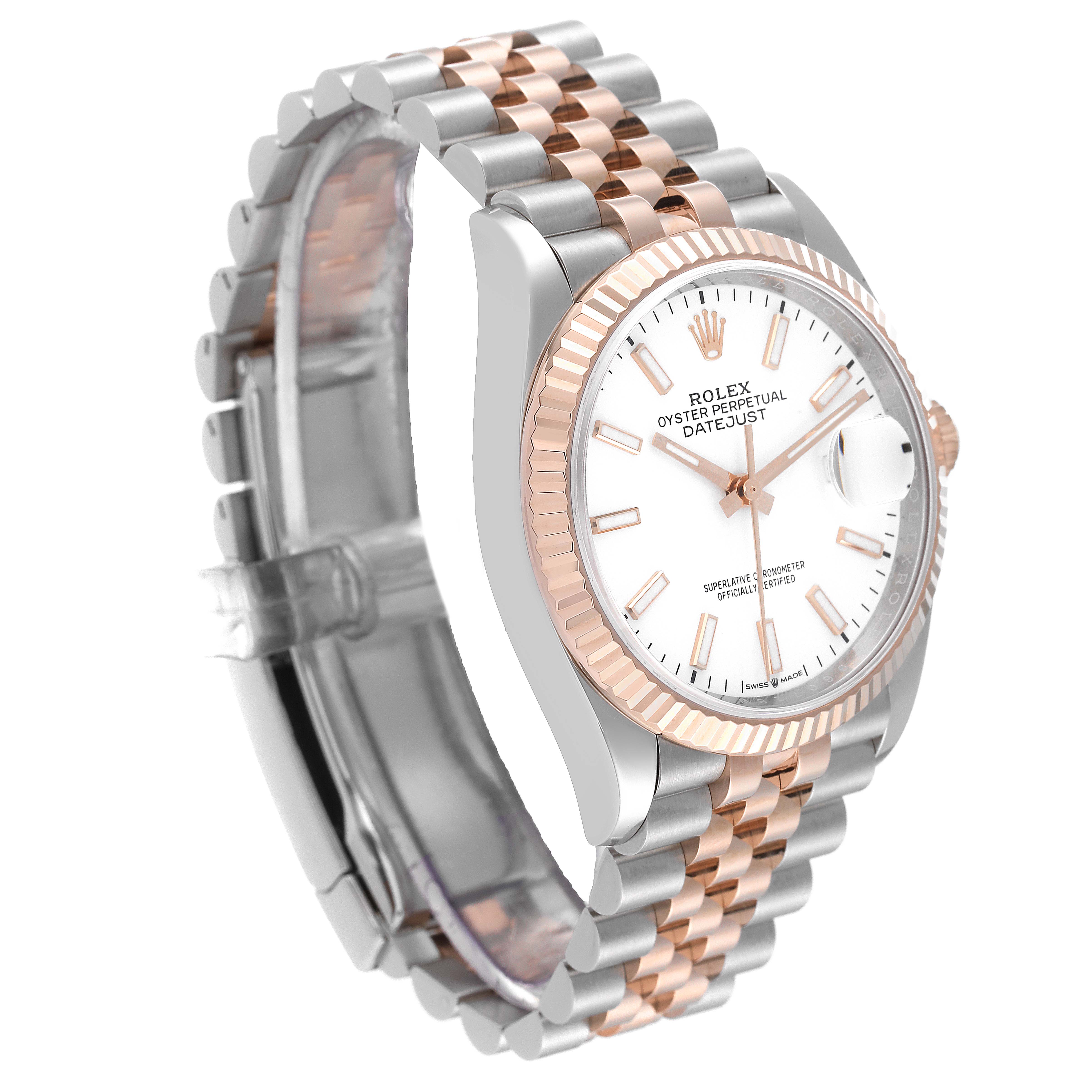 The Rolex Datejust 126231 Men's Steel and Gold (two tone) White Dial 126231 Men's Steel and Gold (two tone) White Dial watch is shown from a front-left angle, highlighting its white dial, fluted bezel, and two-tone bracelet.