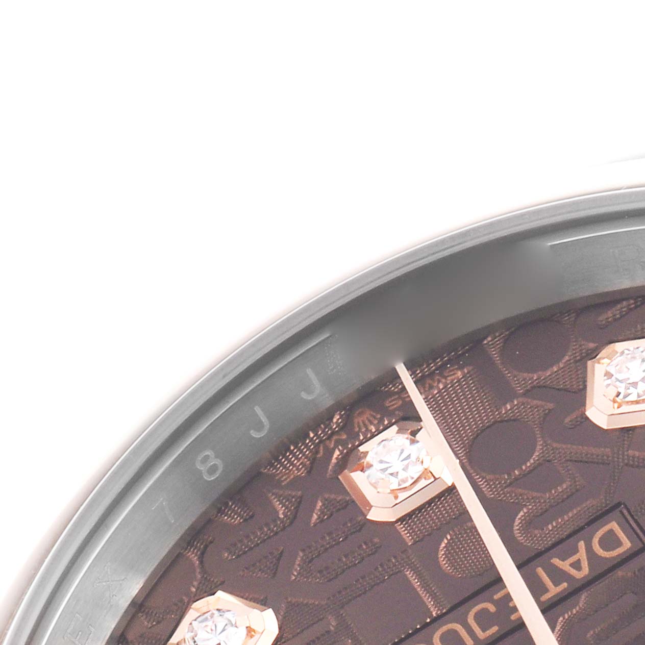 The image shows a close-up angle of a Rolex Datejust 126201G Men's Steel and Gold (two tone) Brown Dial 126201G Men's Steel and Gold (two tone) Brown Dial dial, highlighting diamond markers and partial text.