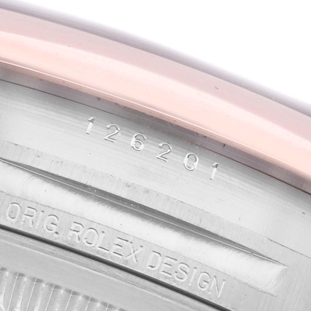 The image shows a close-up of the Rolex Datejust 126201G Men's Steel and Gold (two tone) Brown Dial 126201G Men's Steel and Gold (two tone) Brown Dial model's case side, highlighting the model number engraving.