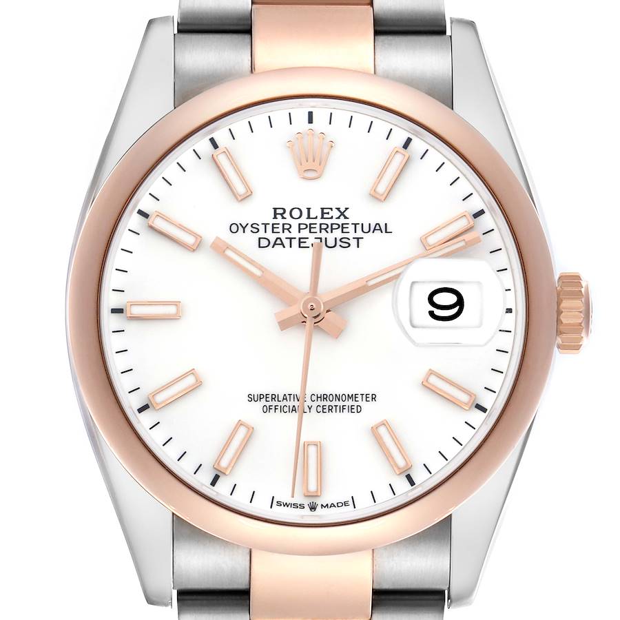 The Rolex Datejust watch is shown from the front, highlighting the dial, indices, hands, date window, and part of the bracelet.