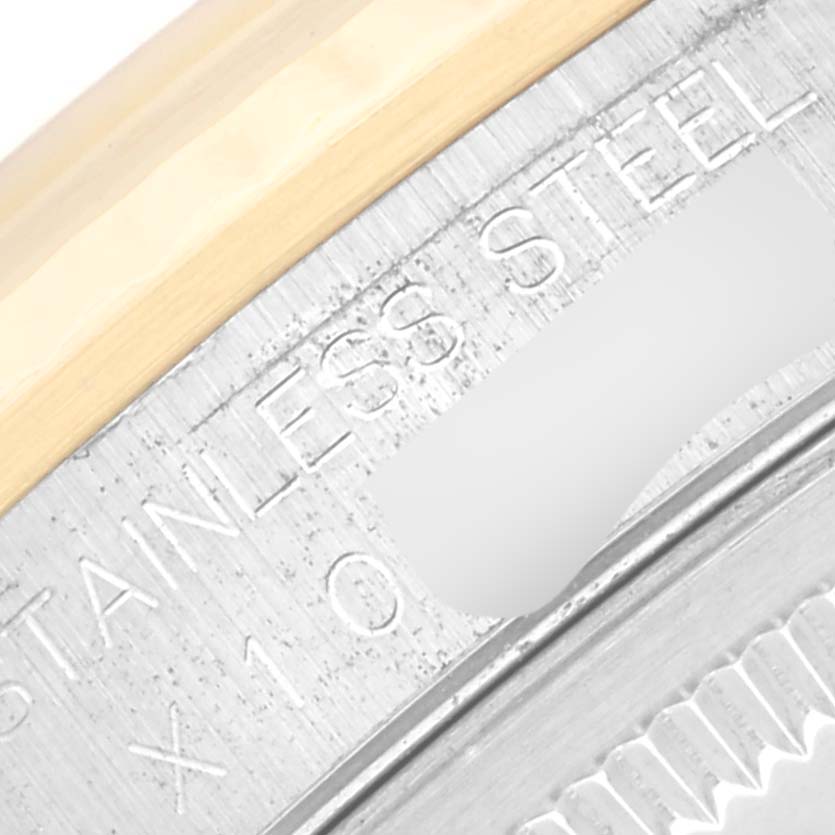 This close-up image shows the engravings on the bezel and outer edge of a Rolex Datejust 16233 Men's Steel and Gold (two tone) Champagne Dial 16233 Men's Steel and Gold (two tone) Champagne Dial stainless steel watch.